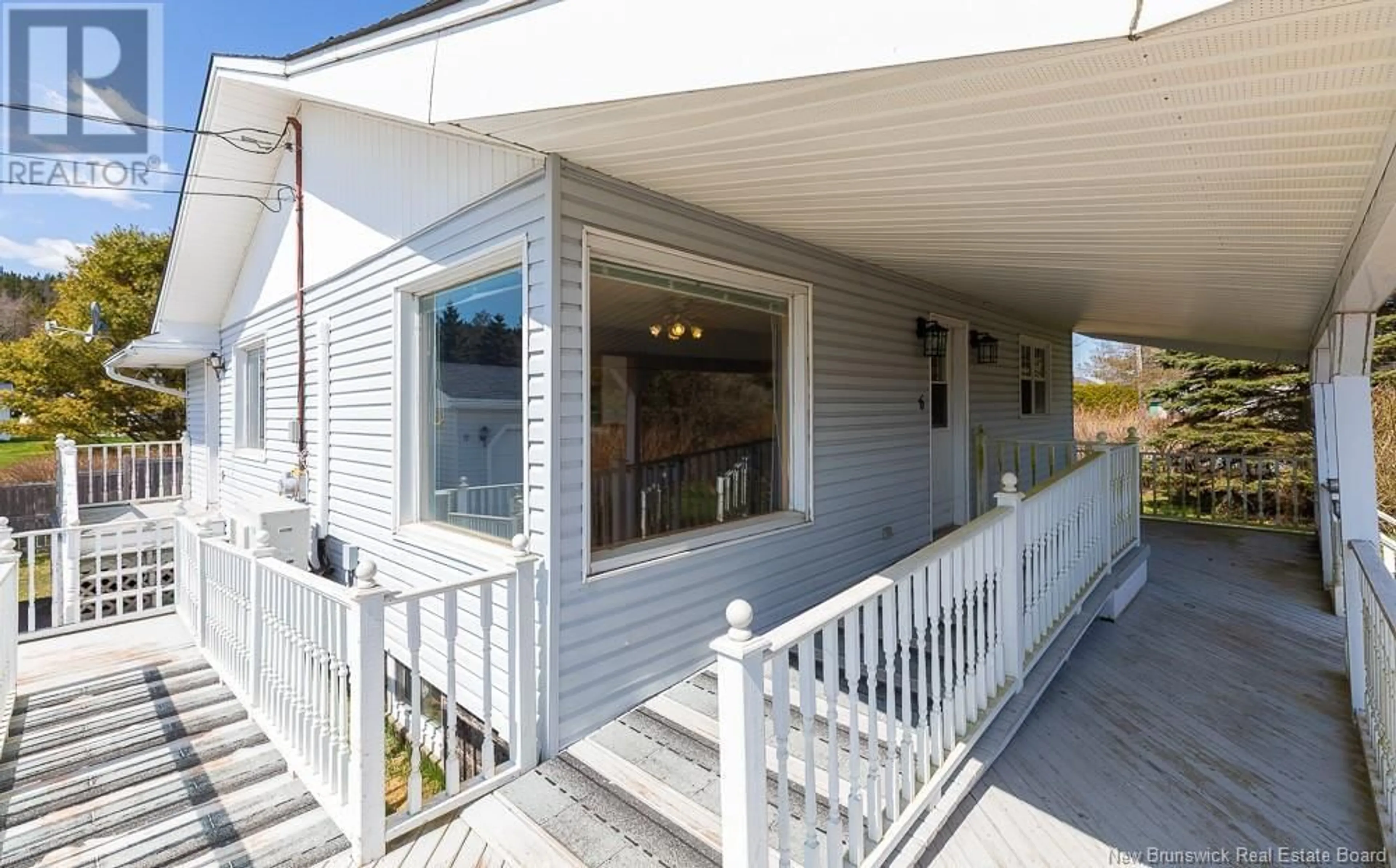 Home with vinyl exterior material, street for 6 MCDONALD LAKE ROAD, Garnett Settlement New Brunswick E2S1W3