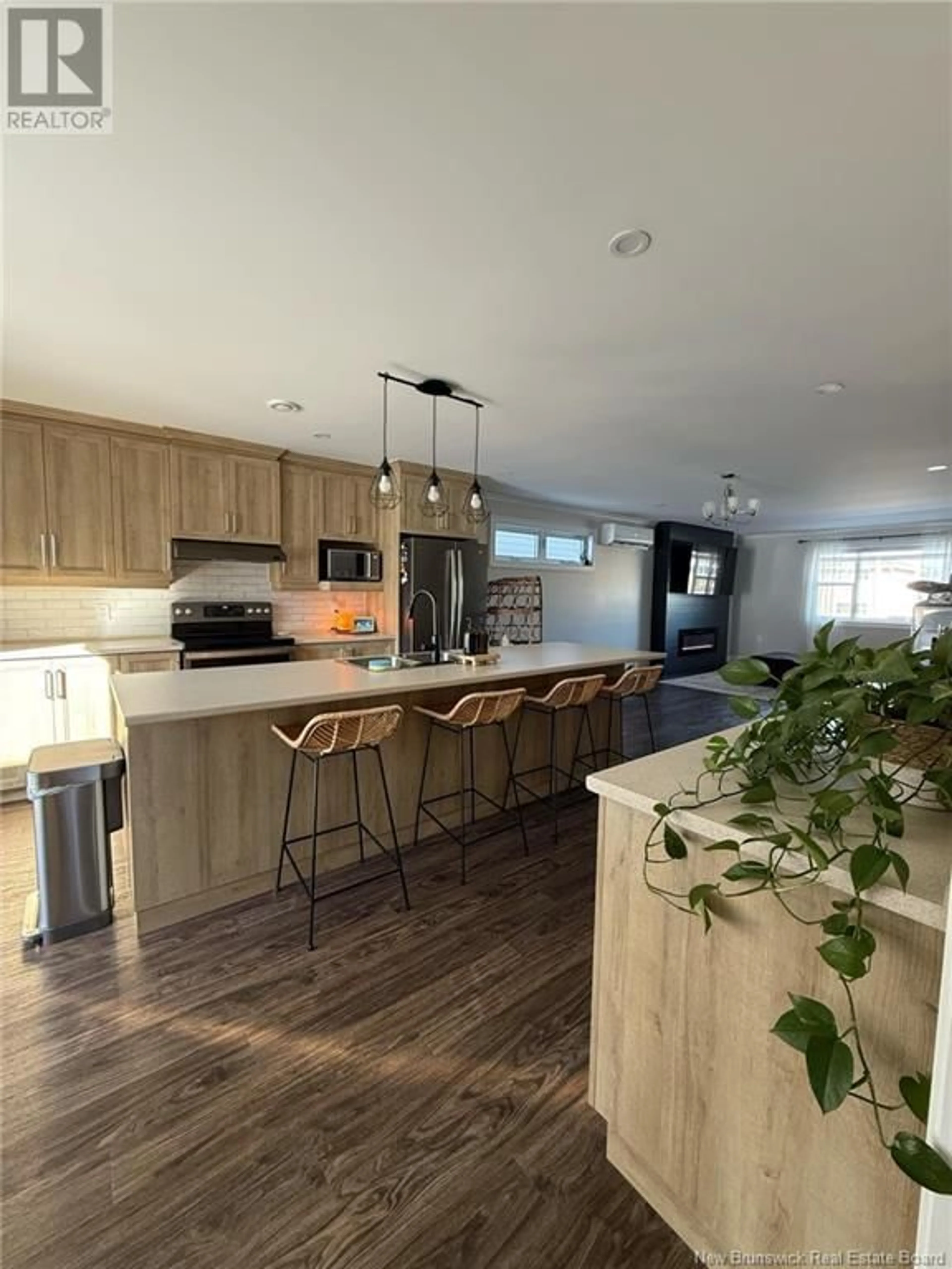 Open concept kitchen, wood/laminate floor for 88 ARRAN STREET, Campbellton New Brunswick E3N1L8