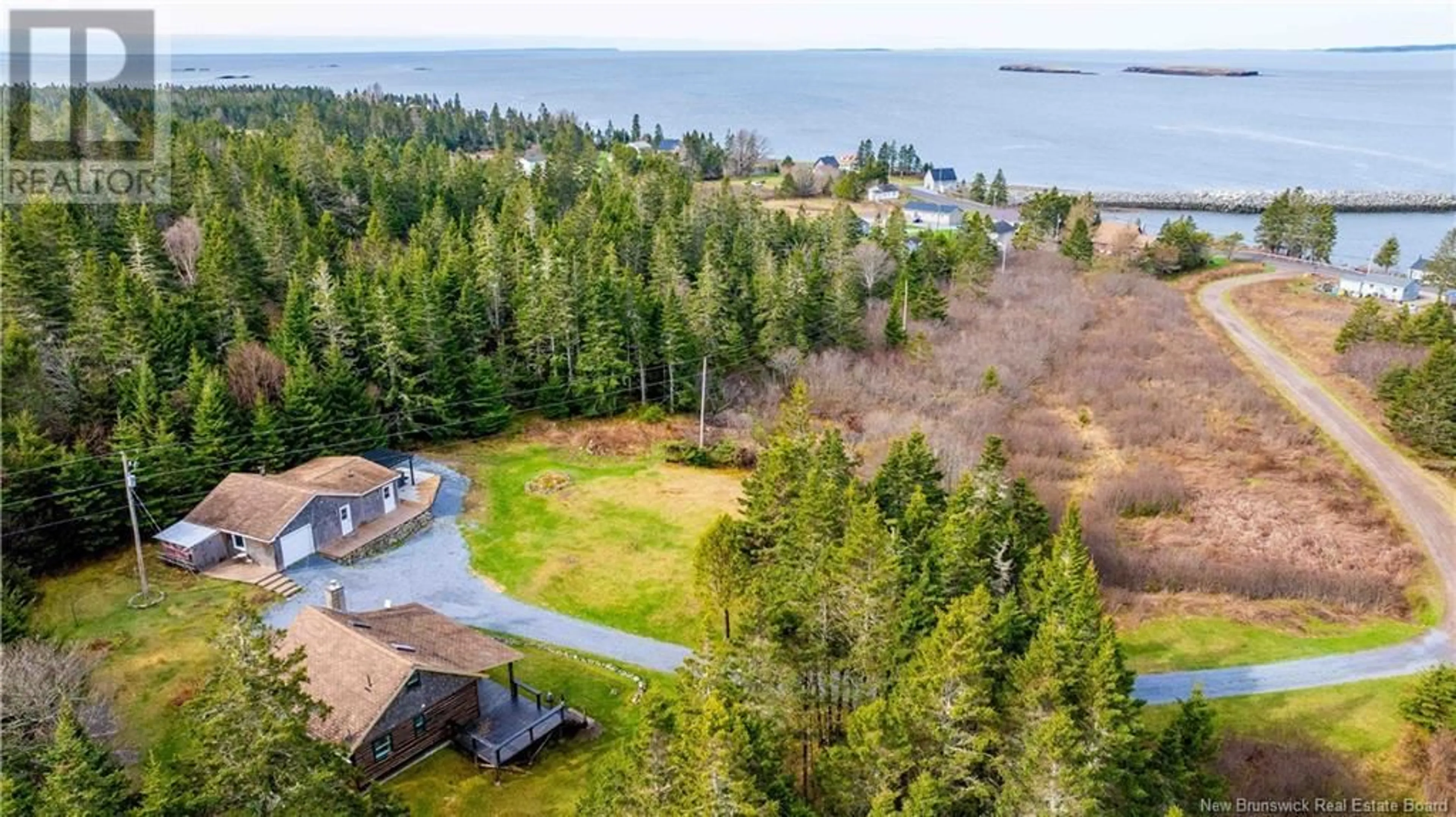 A pic from outside/outdoor area/front of a property/back of a property/a pic from drone, water/lake/river/ocean view for 18 HARLEY DAVIDSON DRIVE, Lepreau New Brunswick E5J2S2