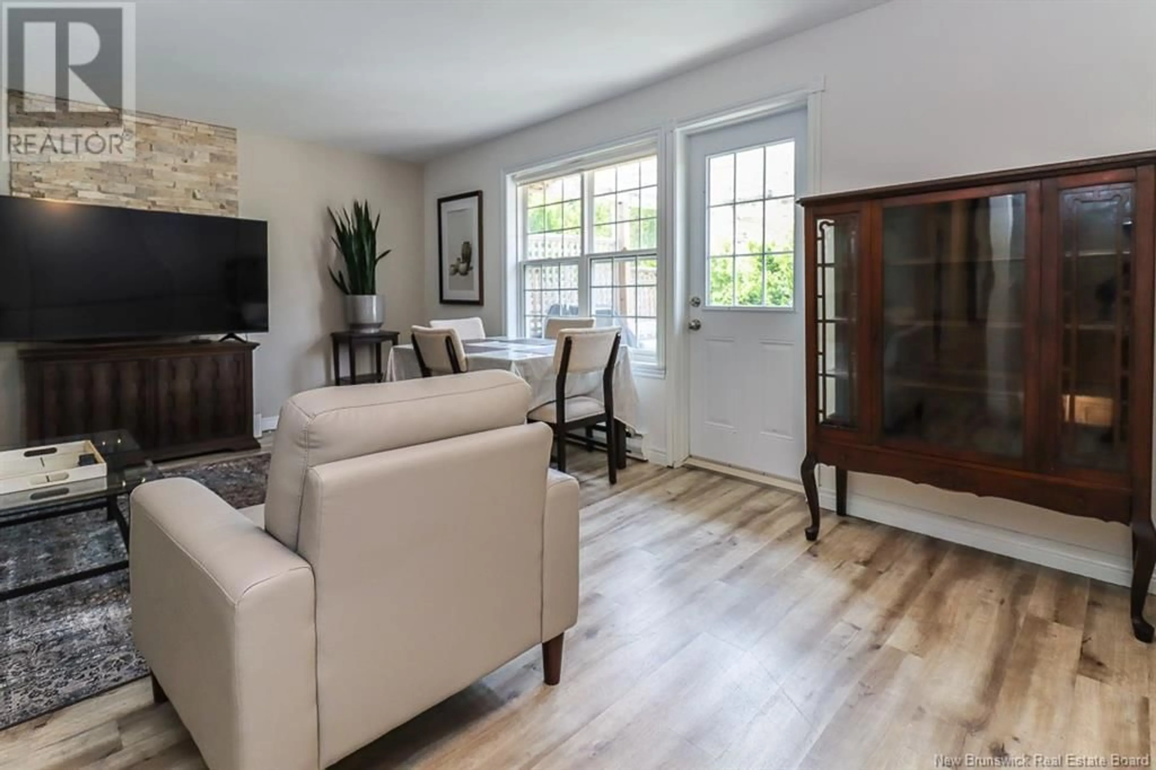 Living room with furniture, wood/laminate floor for 171 LANCASTER STREET, Saint John New Brunswick E2M5A5