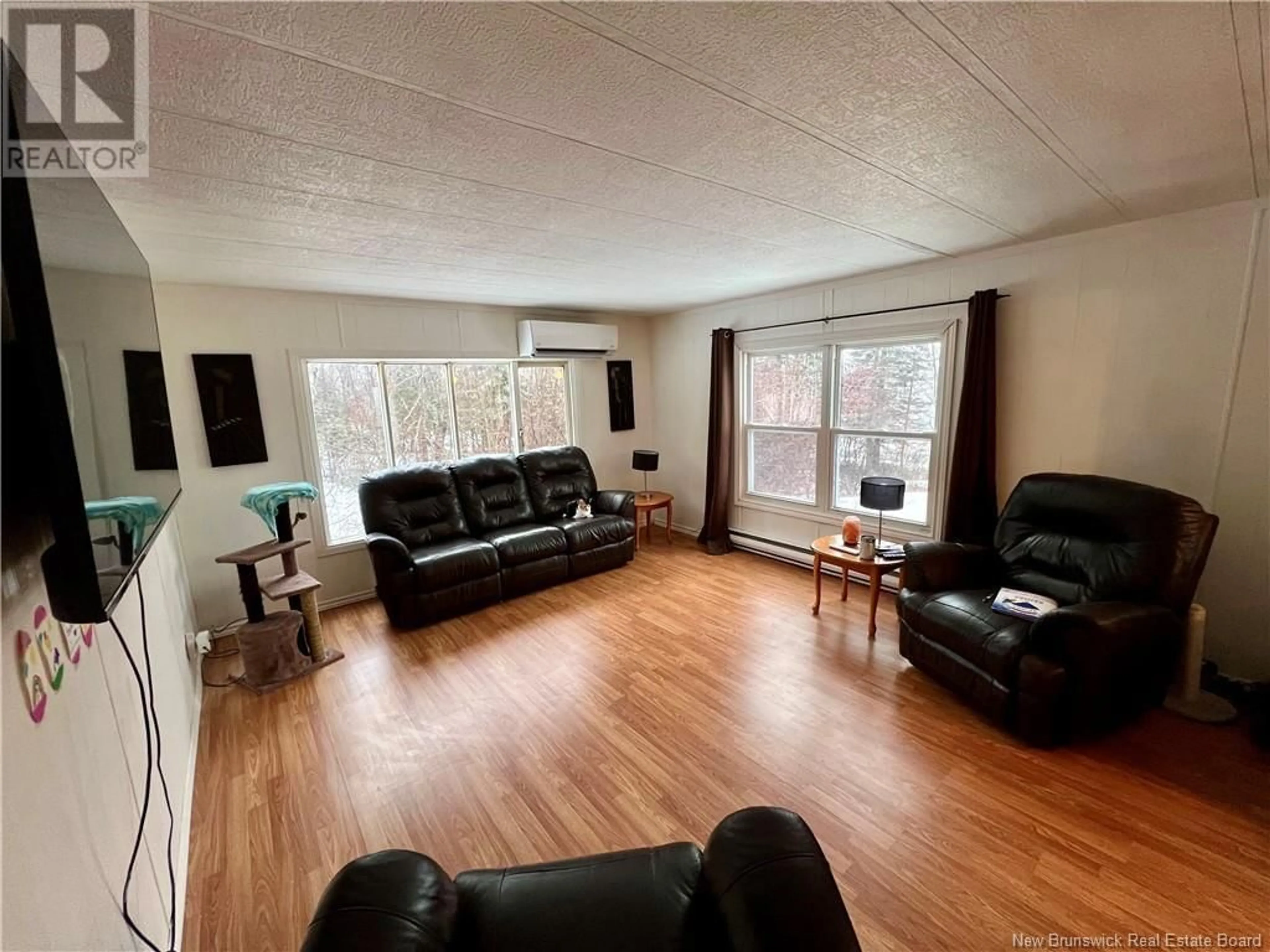 Living room with furniture, wood/laminate floor for 2751 ROUTE 420, Matthews Settlement New Brunswick E9E1V1