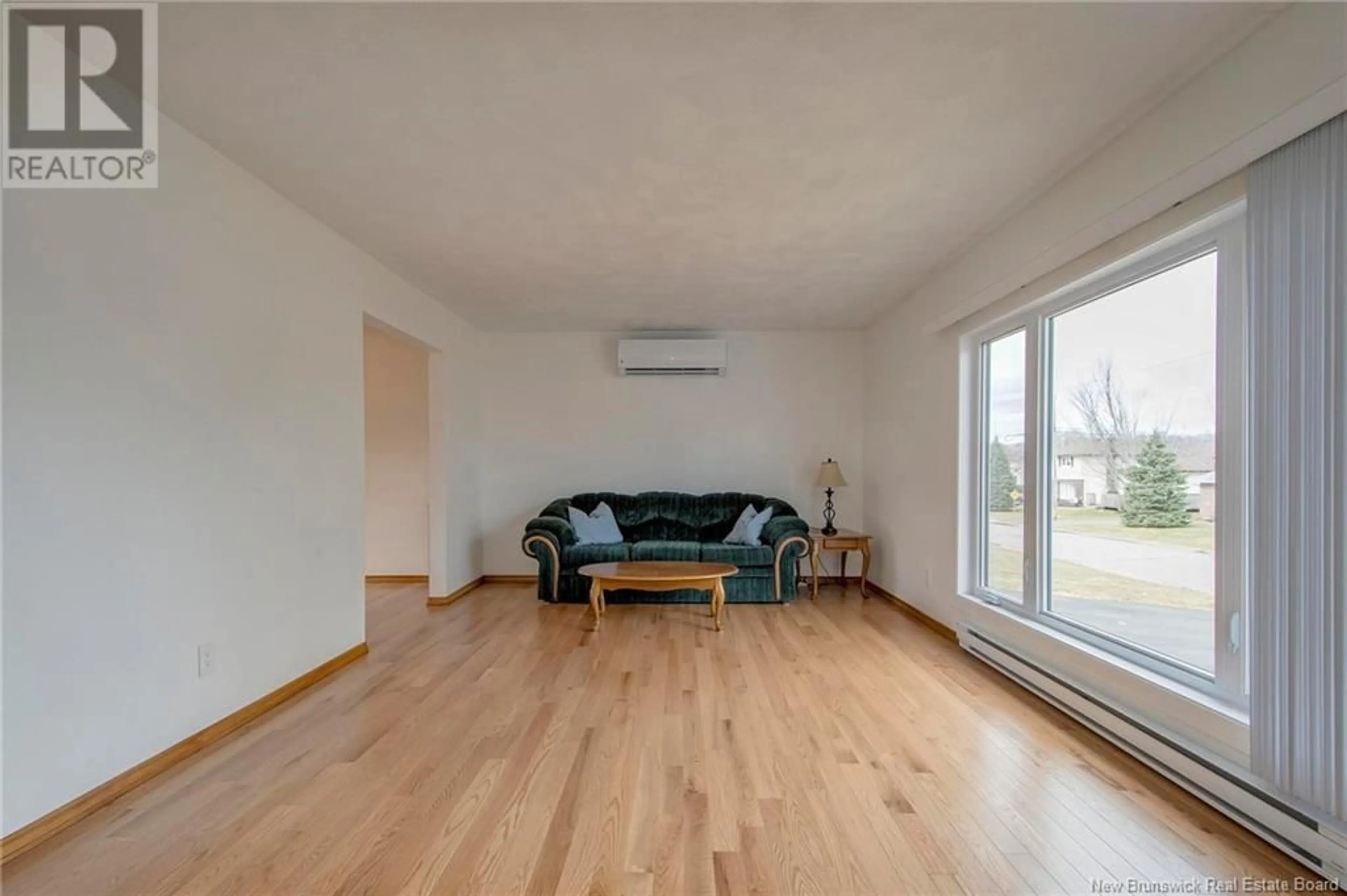 Living room with furniture, wood/laminate floor for 24 CHERRY COURT, Riverview New Brunswick E1B4K2