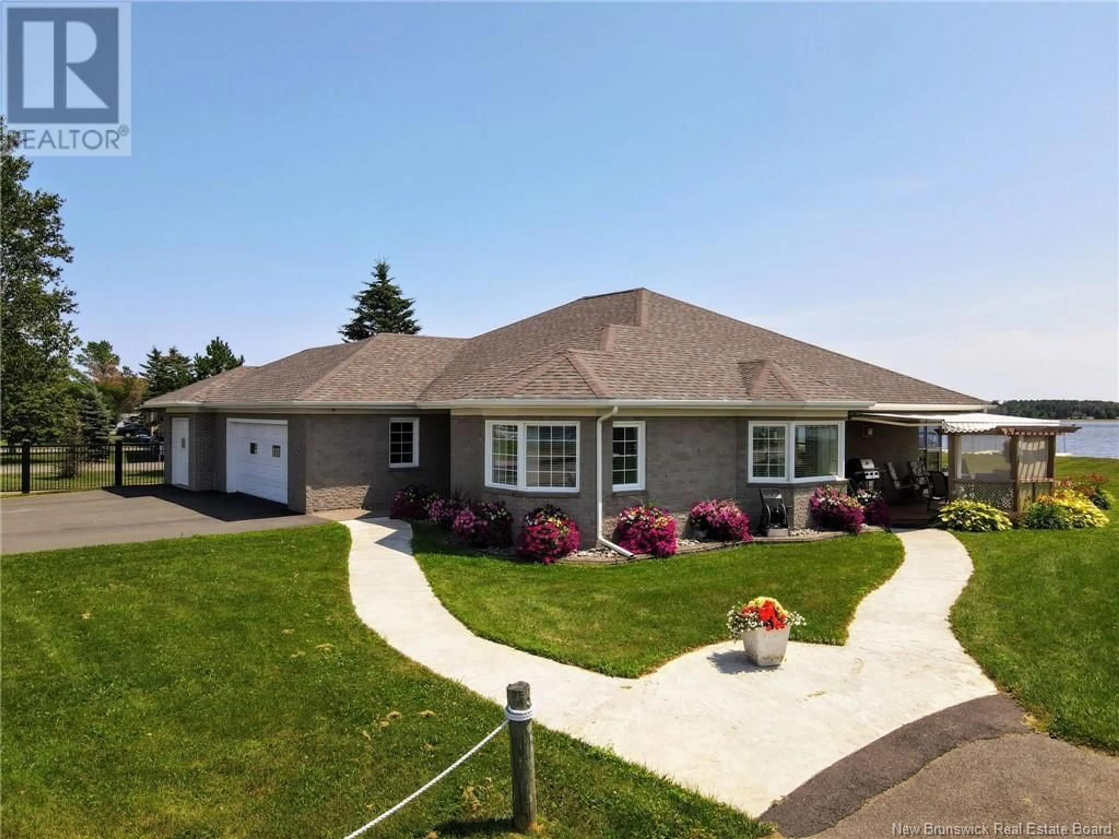 Home with vinyl exterior material, street for 80 York Street, Richibucto New Brunswick E4W4K2