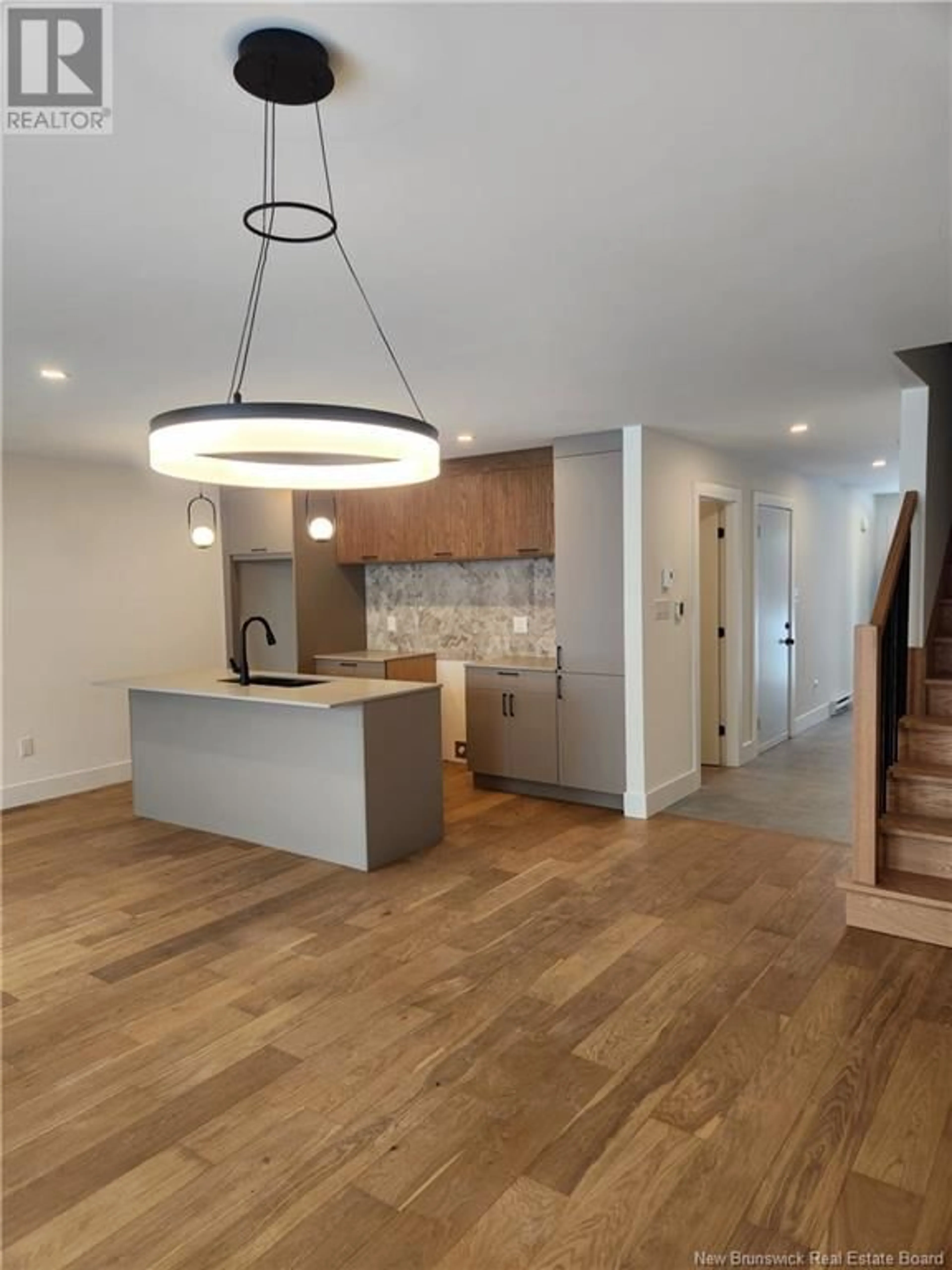 Open concept kitchen, wood/laminate floor for 216 DICKEY BOULEVARD, Riverview New Brunswick E1B4X2