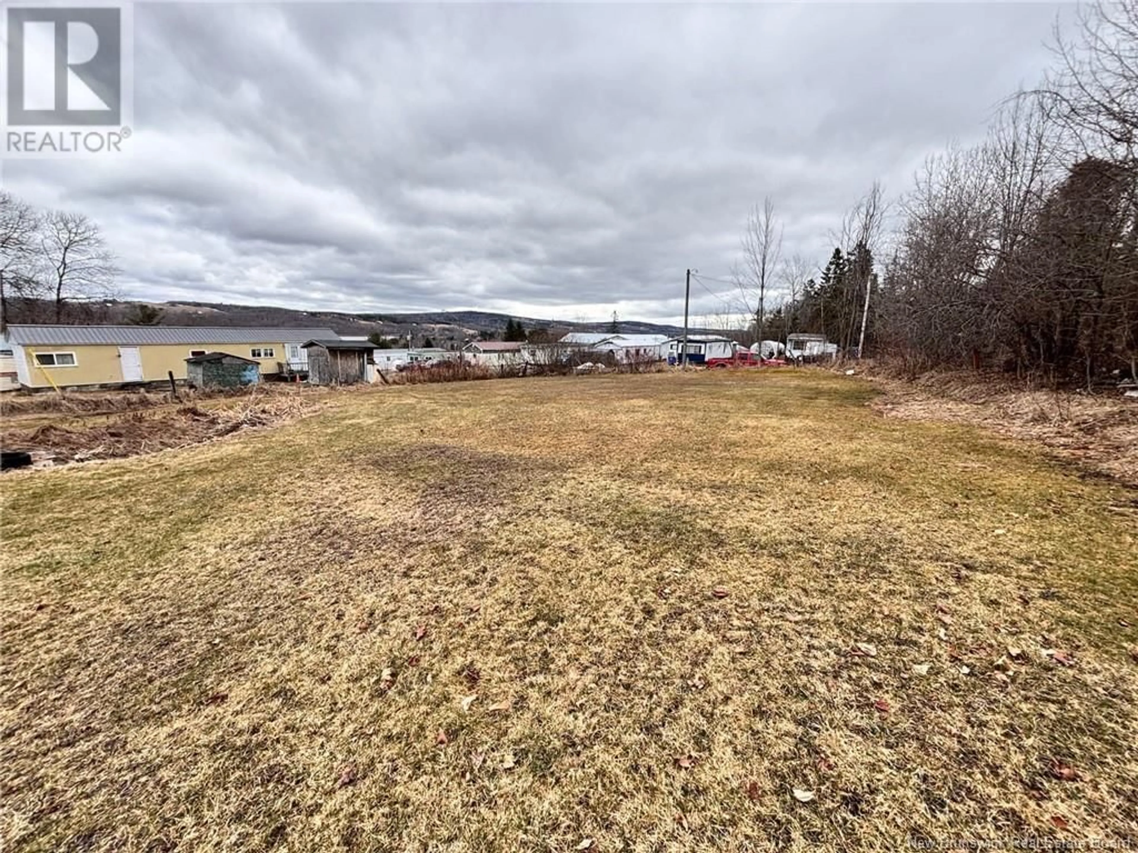 A pic from outside/outdoor area/front of a property/back of a property/a pic from drone, water/lake/river/ocean view for 187 CHARLES STREET, Woodstock New Brunswick E7M1H9
