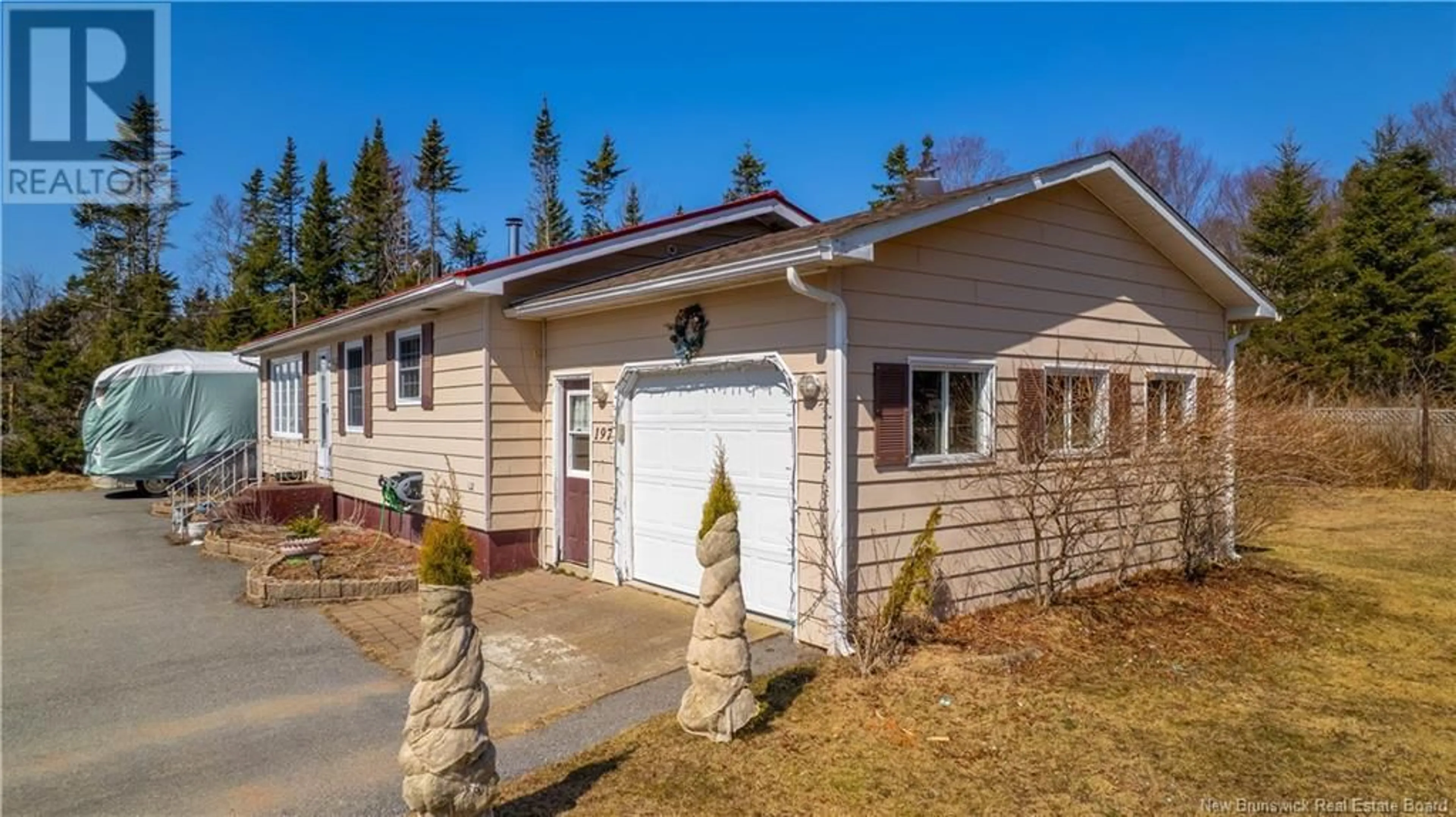 Home with vinyl exterior material, street for 197 MUNROE ROAD, Pennfield New Brunswick E5H2B3