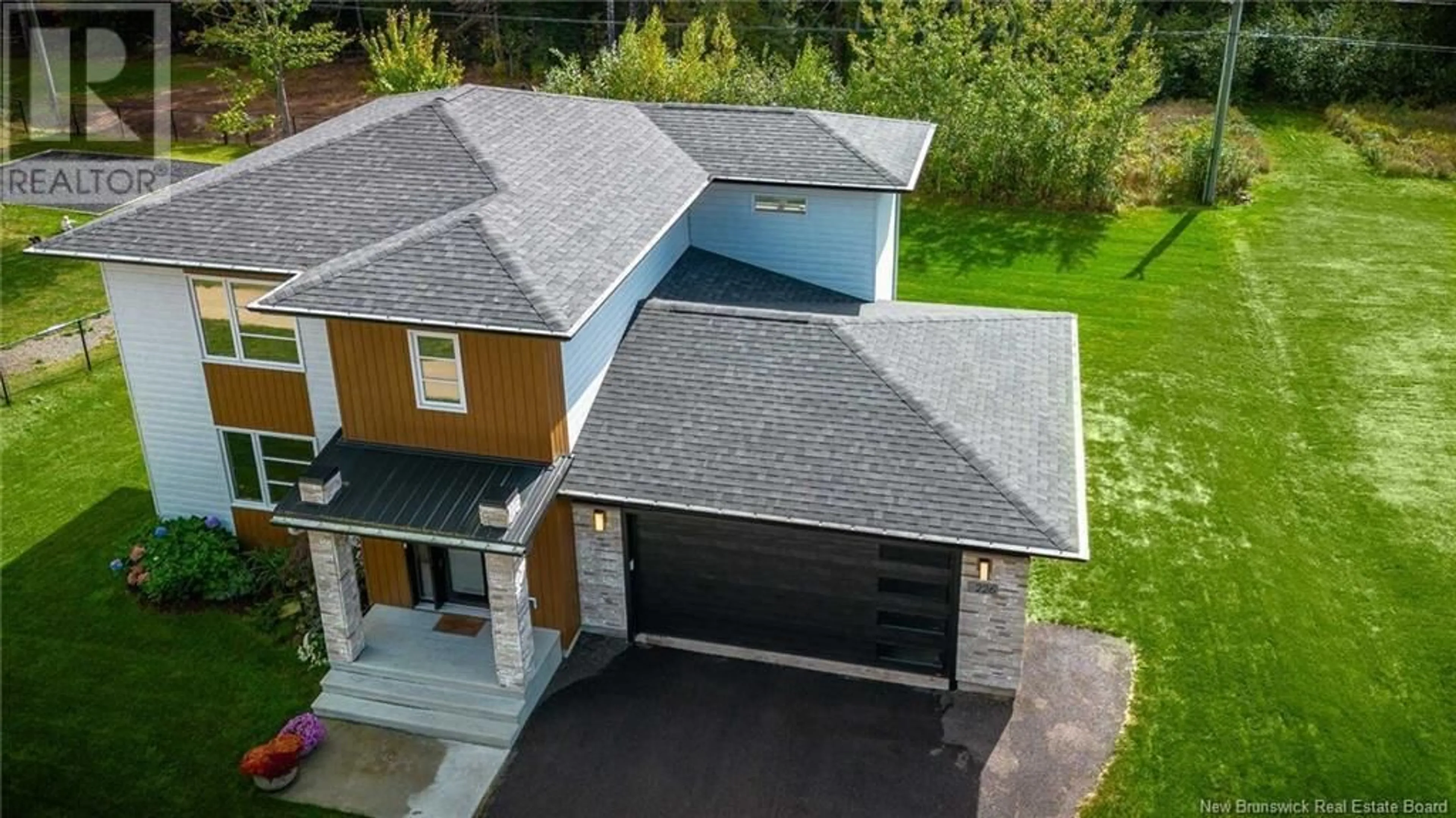 A pic from outside/outdoor area/front of a property/back of a property/a pic from drone, street for 226 LEOPOLD F. BELLIVEAU DRIVE, Moncton New Brunswick E1A9N9