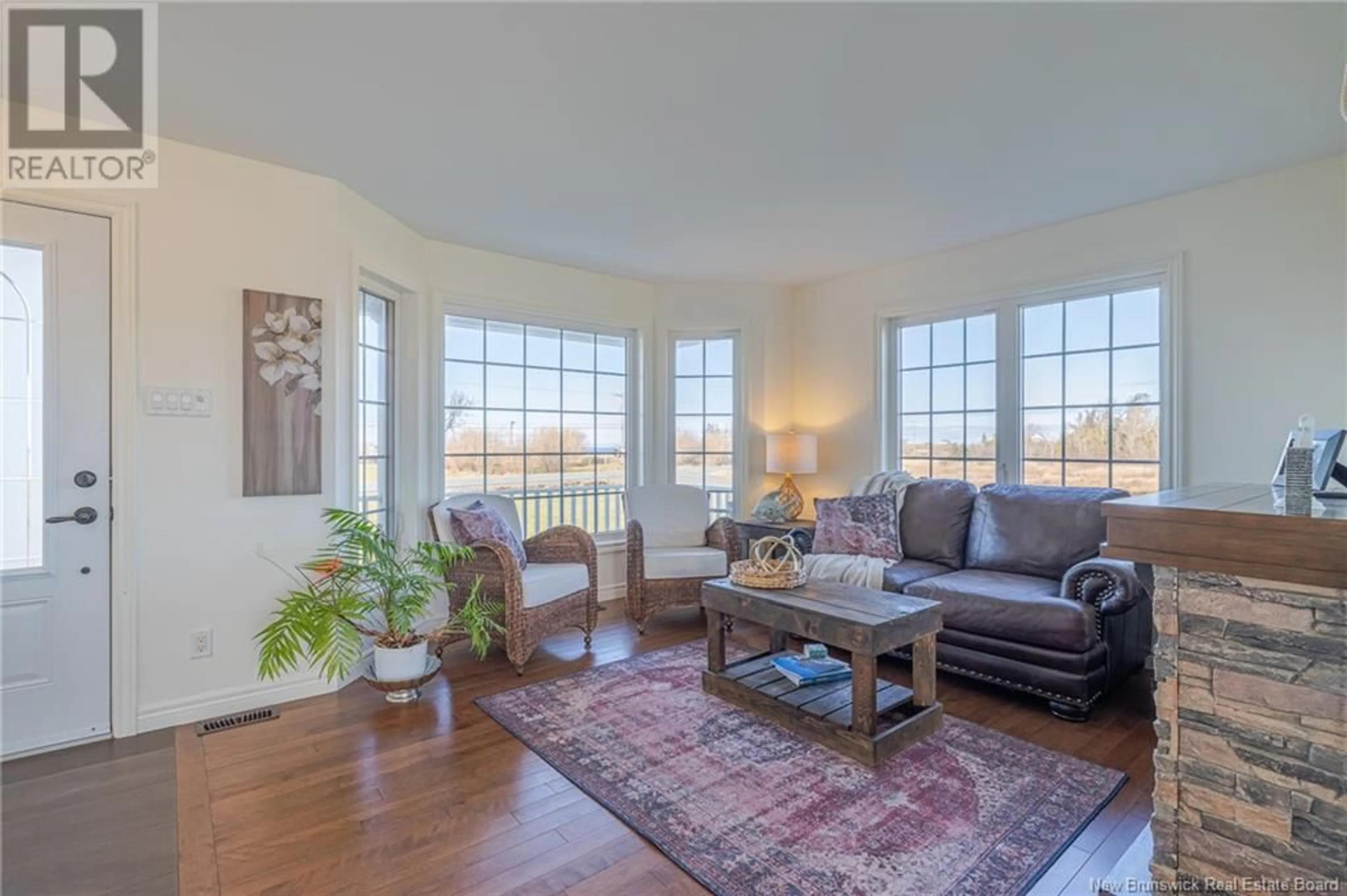 Living room with furniture, wood/laminate floor for 6642 ROUTE 11, Clifton New Brunswick E2A5L8