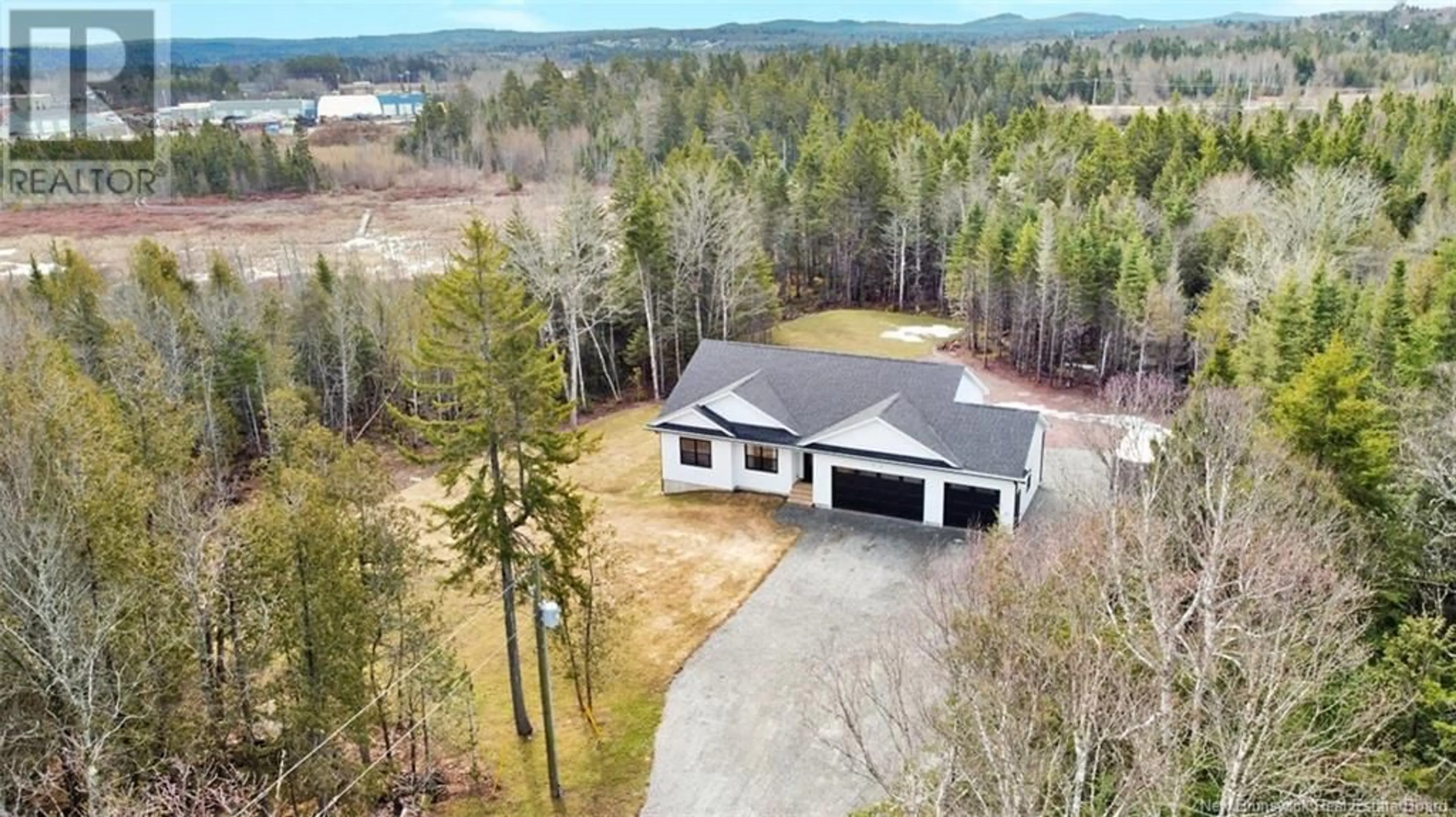 Home with vinyl exterior material, street for 50 CHAMBERLAIN ROAD, Quispamsis New Brunswick E2G1C1