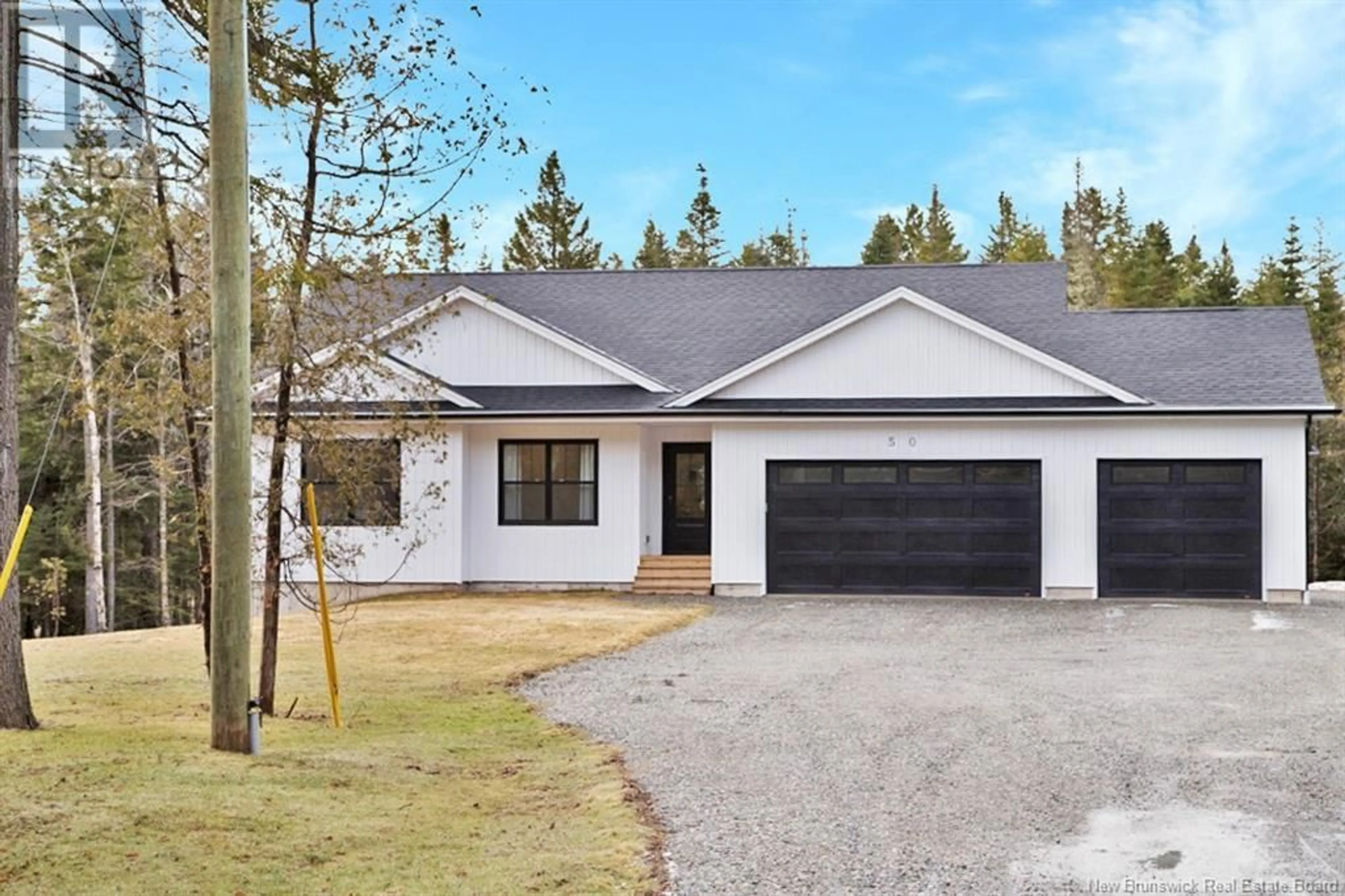 Home with vinyl exterior material, street for 50 CHAMBERLAIN ROAD, Quispamsis New Brunswick E2G1C1