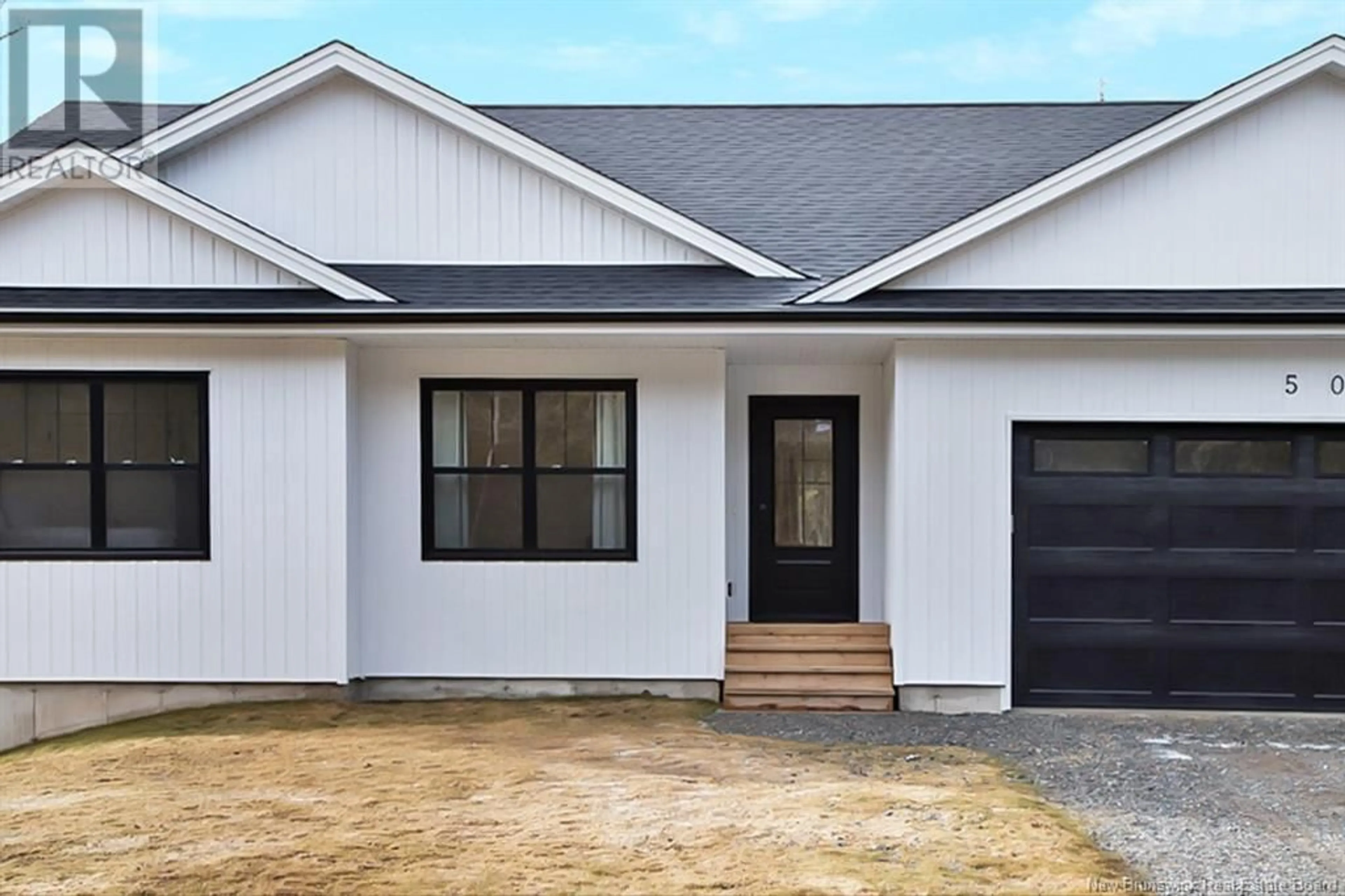 Home with vinyl exterior material, street for 50 CHAMBERLAIN ROAD, Quispamsis New Brunswick E2G1C1