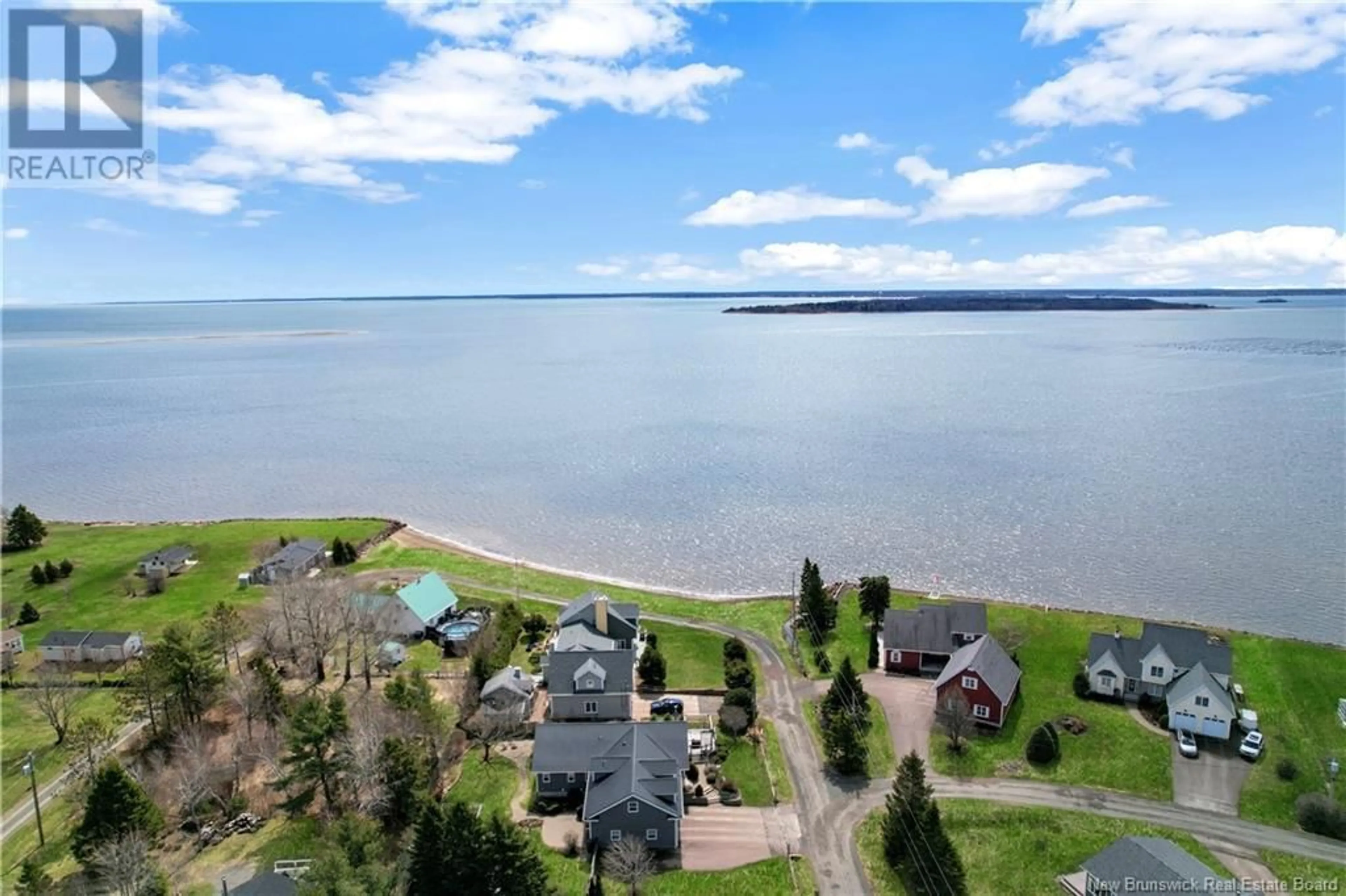 A pic from outside/outdoor area/front of a property/back of a property/a pic from drone, water/lake/river/ocean view for 75 LOUIS-A-CHARLES STREET, Grande-Digue New Brunswick E4R4S5