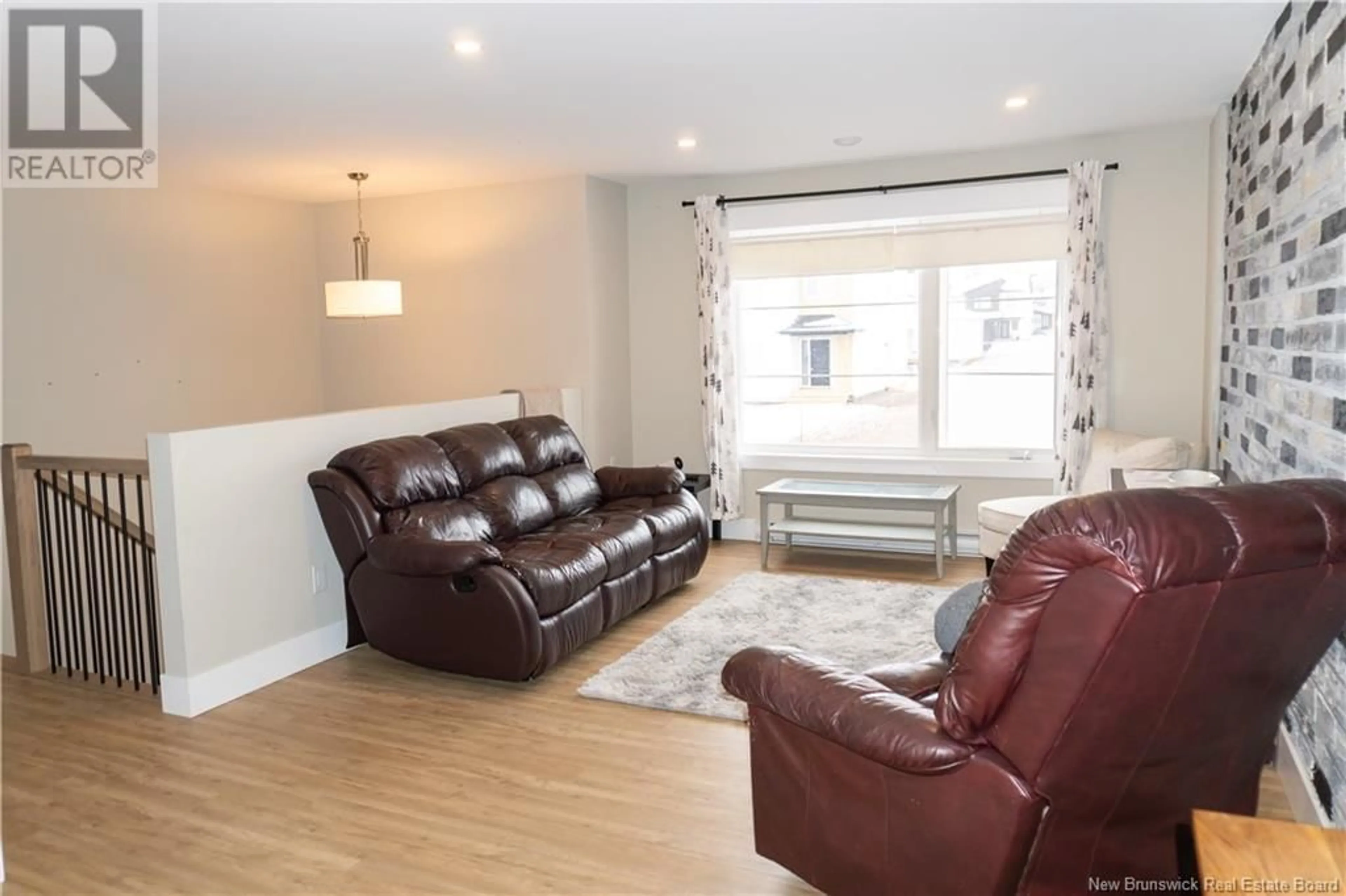Living room with furniture, wood/laminate floor for 161 ERNEST STREET, Dieppe New Brunswick E1A4T3