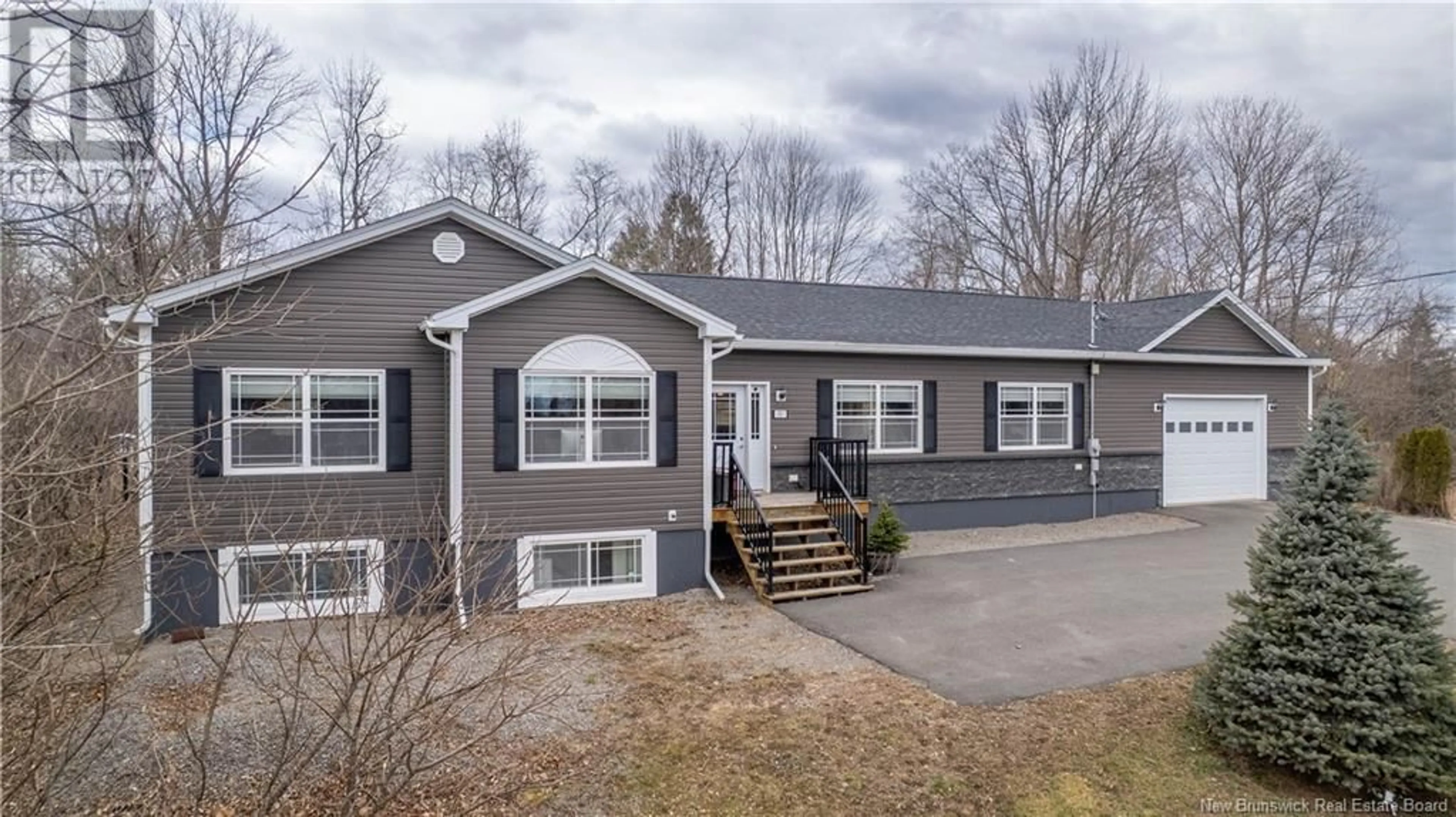 Home with vinyl exterior material, street for 11 QUEENSWAY WAY, St. Stephen New Brunswick E3L1L1