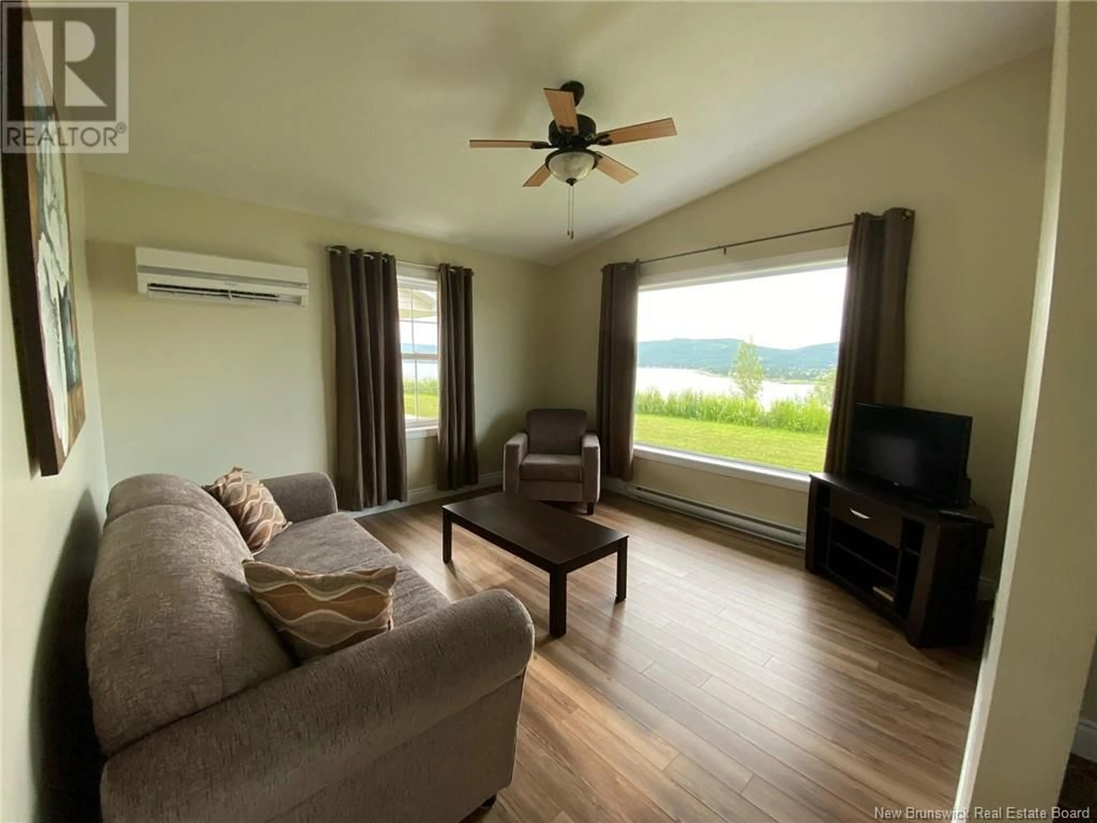 Living room with furniture, wood/laminate floor for 267 ROSEBERRY STREET, Campbellton New Brunswick E3N2G8