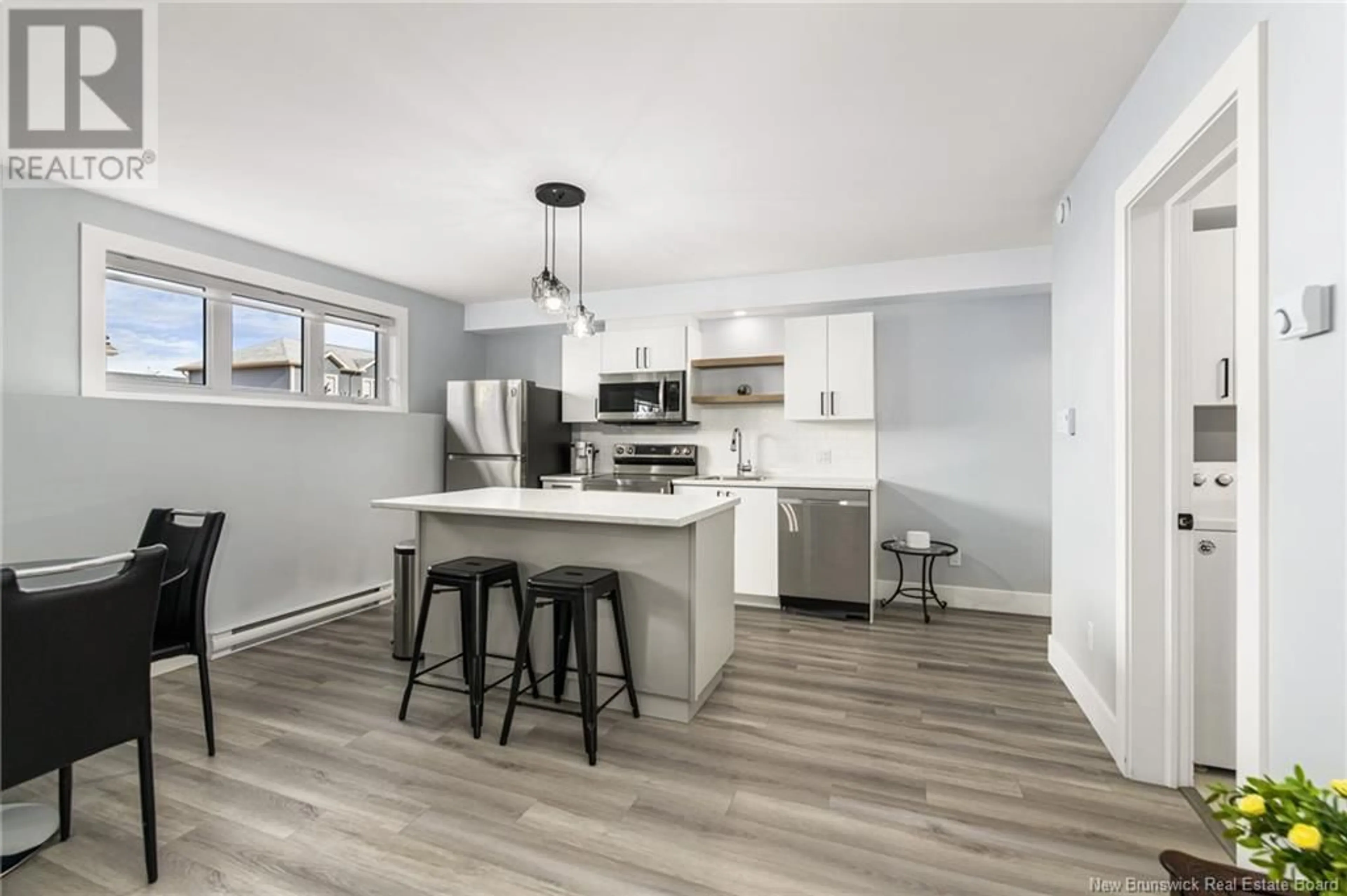 Open concept kitchen, wood/laminate floor for 75 SEBASTIEN STREET, Shediac New Brunswick E4P9A5