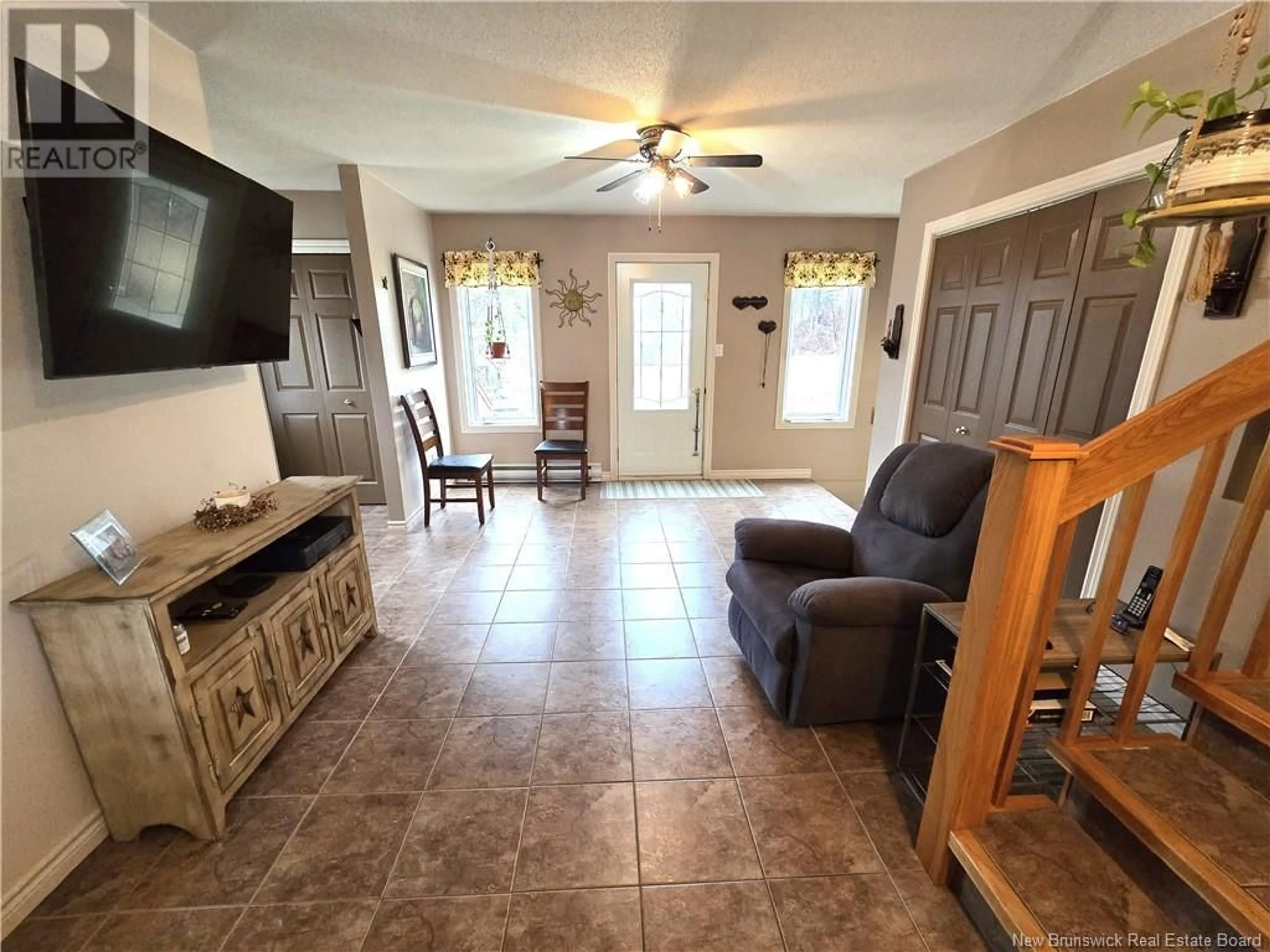 Living room with furniture, ceramic/tile floor for 2095 COMMERCIALE STREET, Saint-François-de-Madawaska New Brunswick E7A1B3
