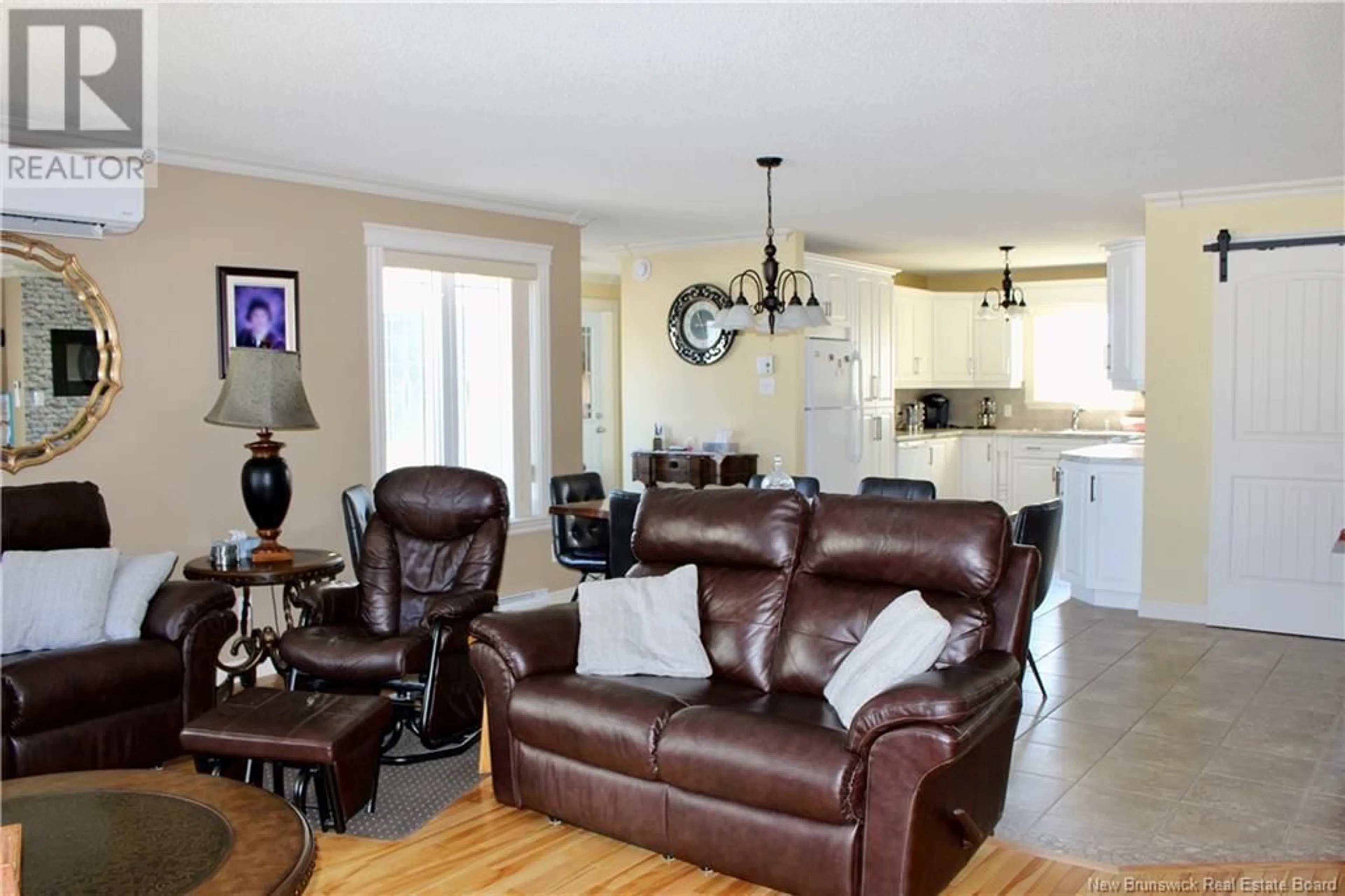 Living room with furniture, wood/laminate floor for 426 DE LA BAIE STREET, Nigadoo New Brunswick E8K3P7