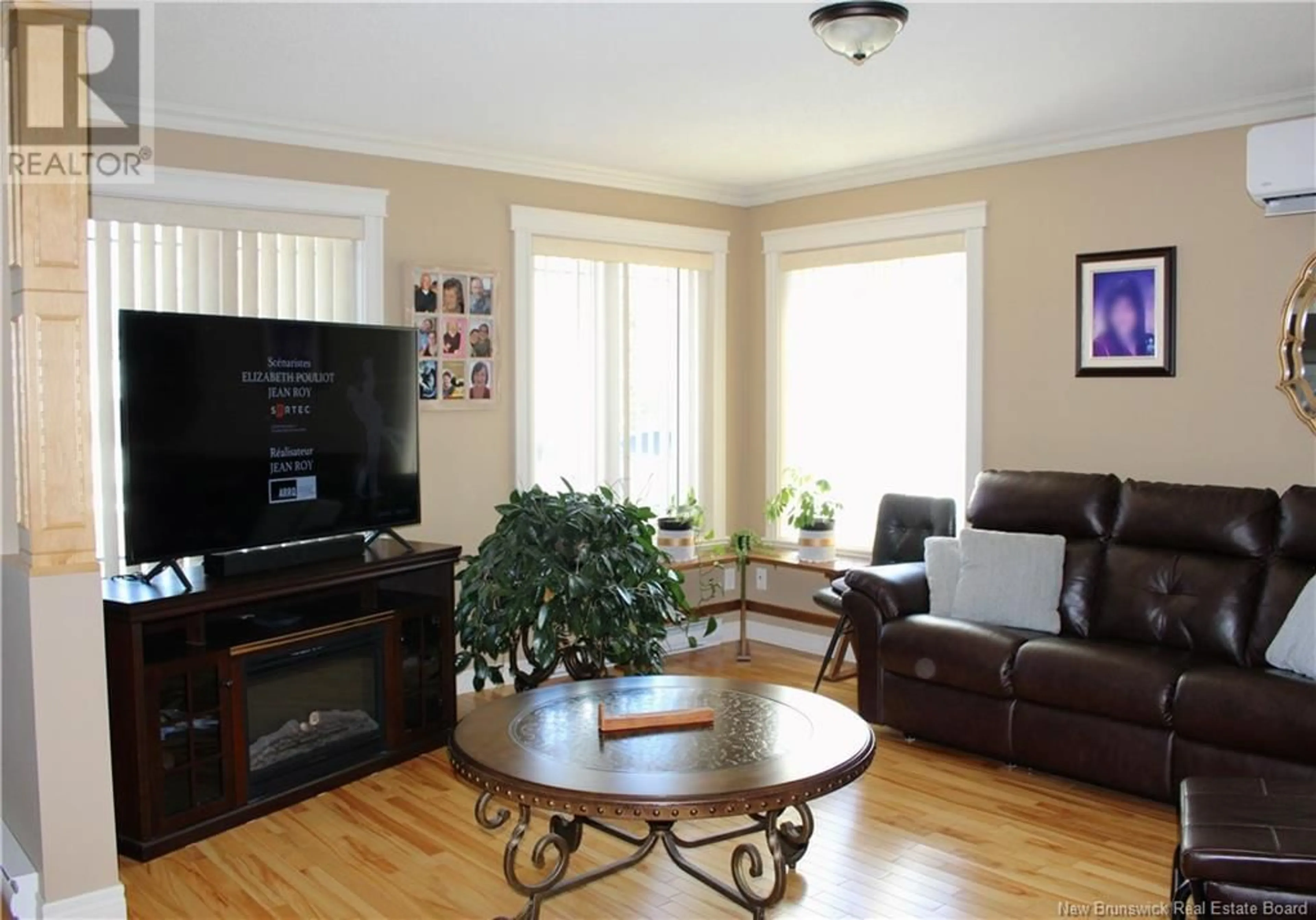 Living room with furniture, wood/laminate floor for 426 DE LA BAIE STREET, Nigadoo New Brunswick E8K3P7