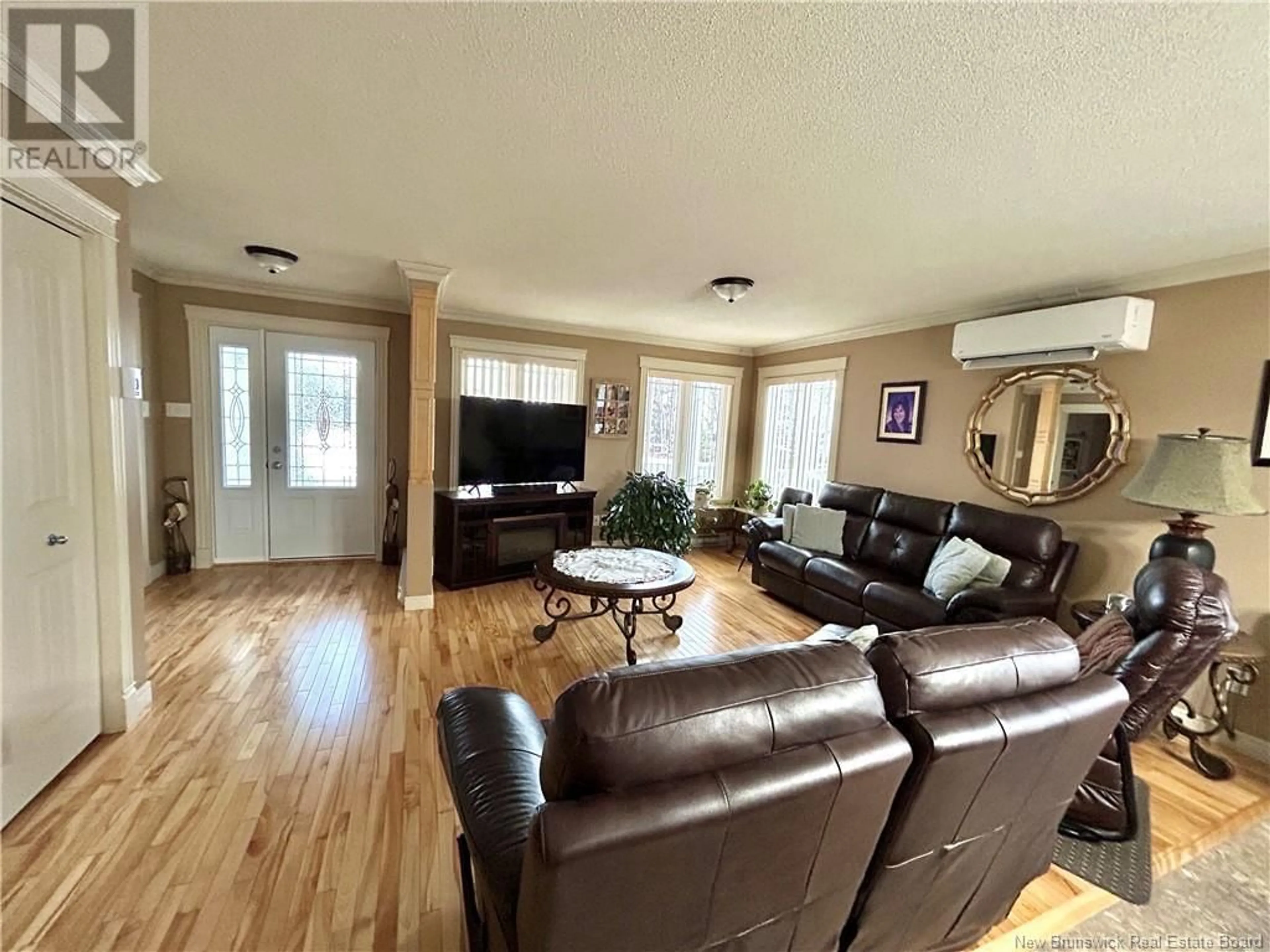 Living room with furniture, wood/laminate floor for 426 DE LA BAIE STREET, Nigadoo New Brunswick E8K3P7