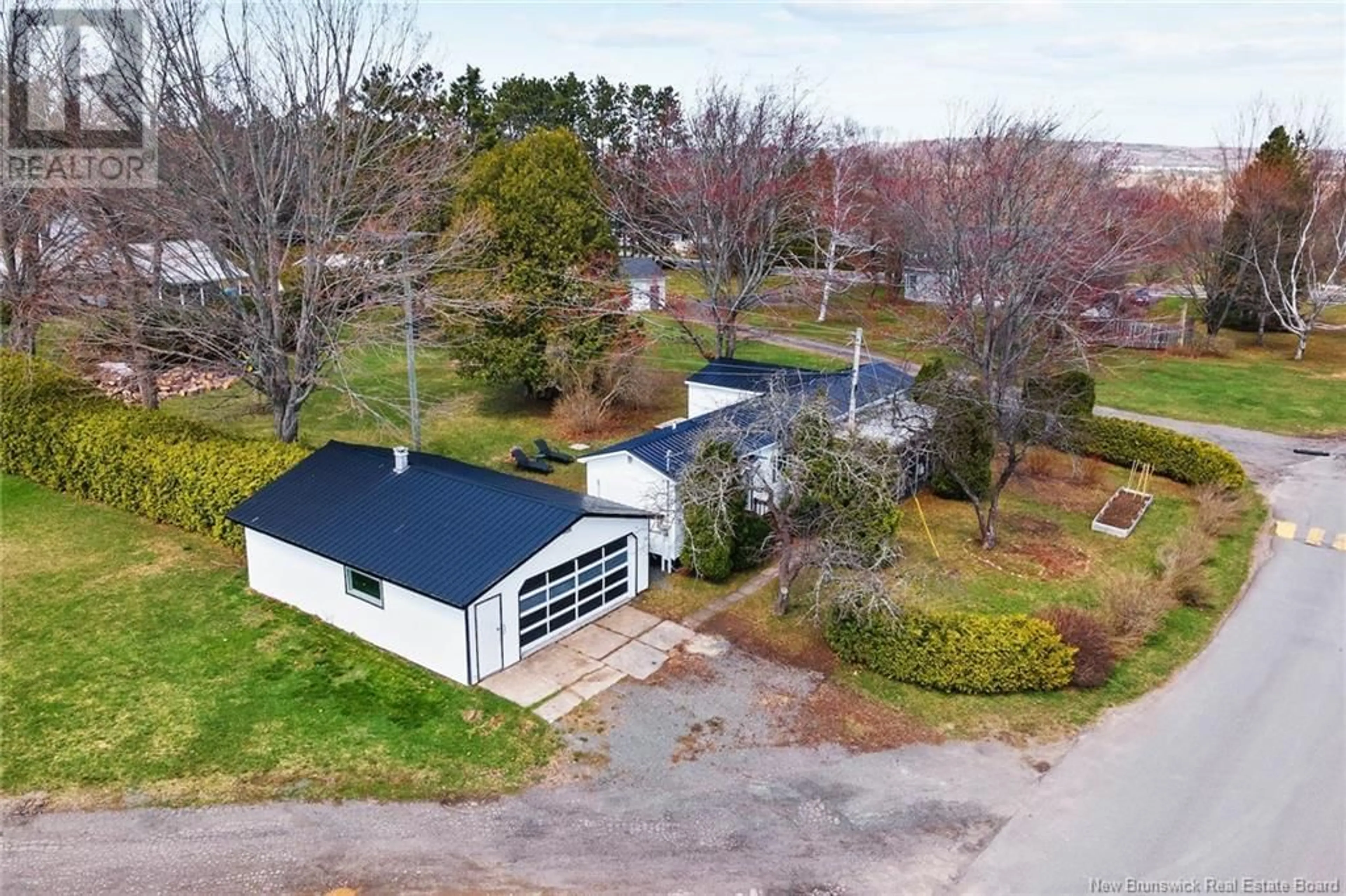 A pic from outside/outdoor area/front of a property/back of a property/a pic from drone, unknown for 6 KELLY'S DRIVE, Fredericton New Brunswick E3B7R2