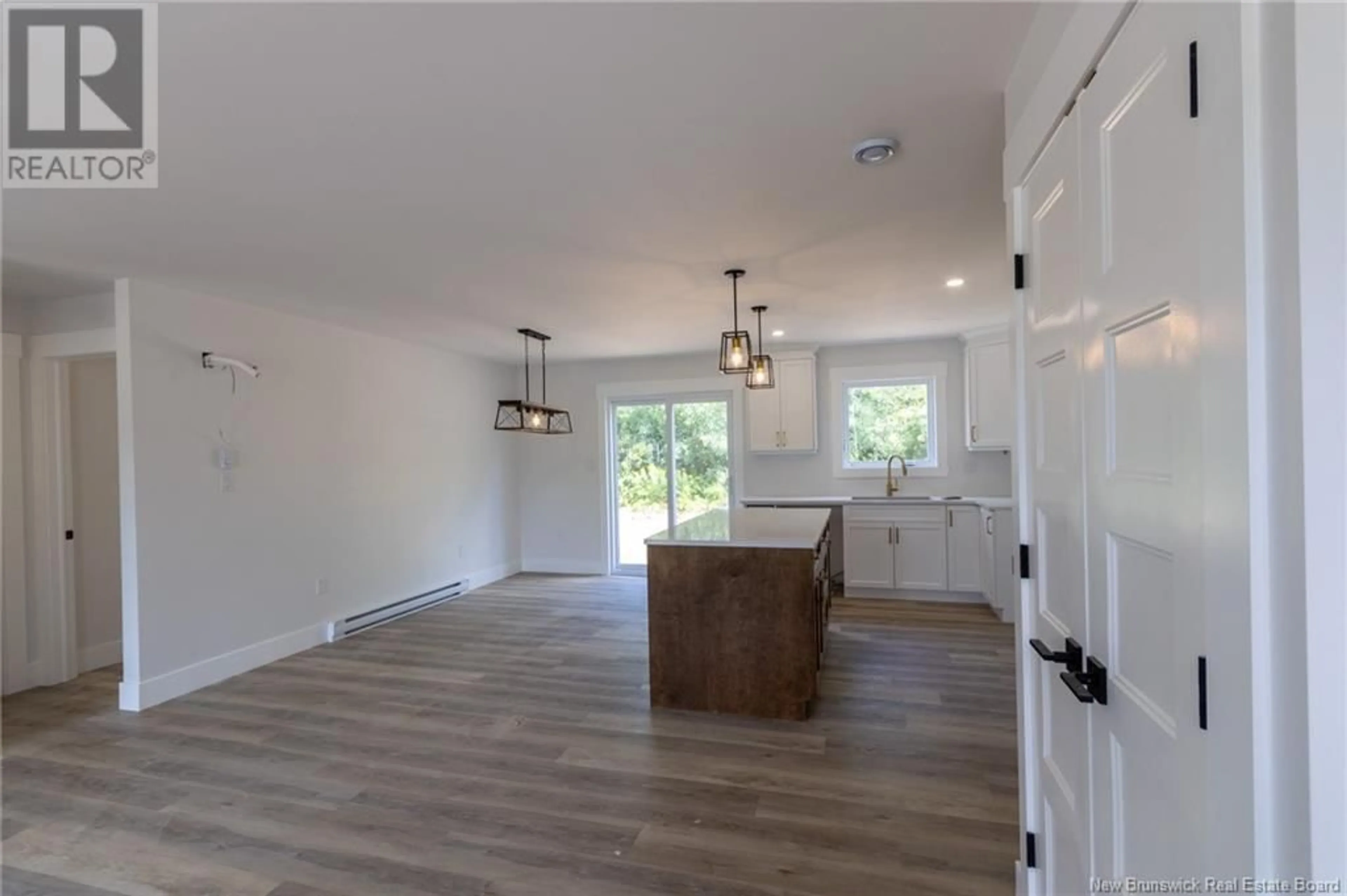 Open concept kitchen, wood/laminate floor for 4004 ROUTE 620, Tay Creek New Brunswick E6B1J8