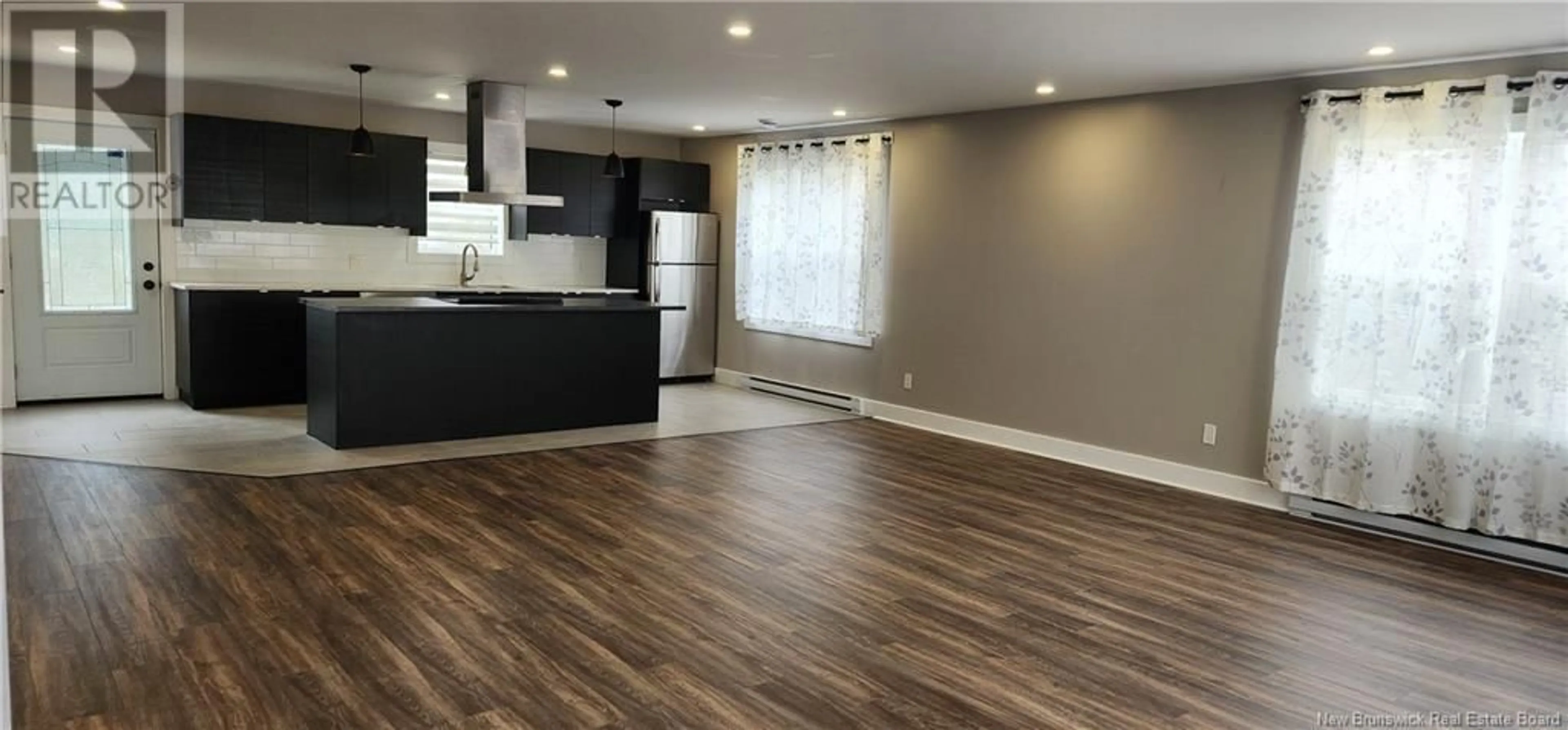 Open concept kitchen, wood/laminate floor for 202 CHURCHILL, Moncton New Brunswick E1C7J9