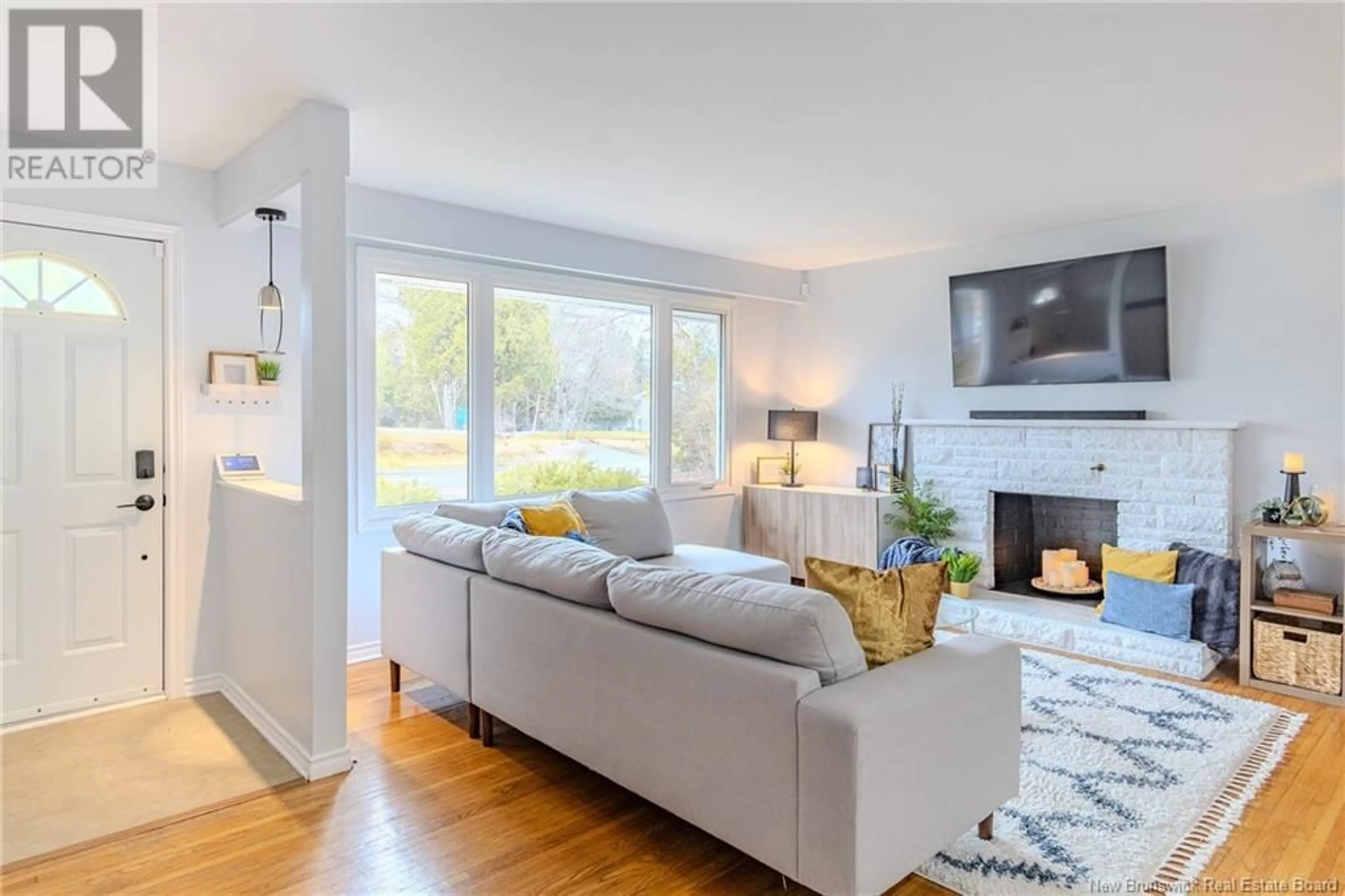 Living room with furniture, wood/laminate floor for 18 HIGHLAND AVENUE, Rothesay New Brunswick E2E5M8
