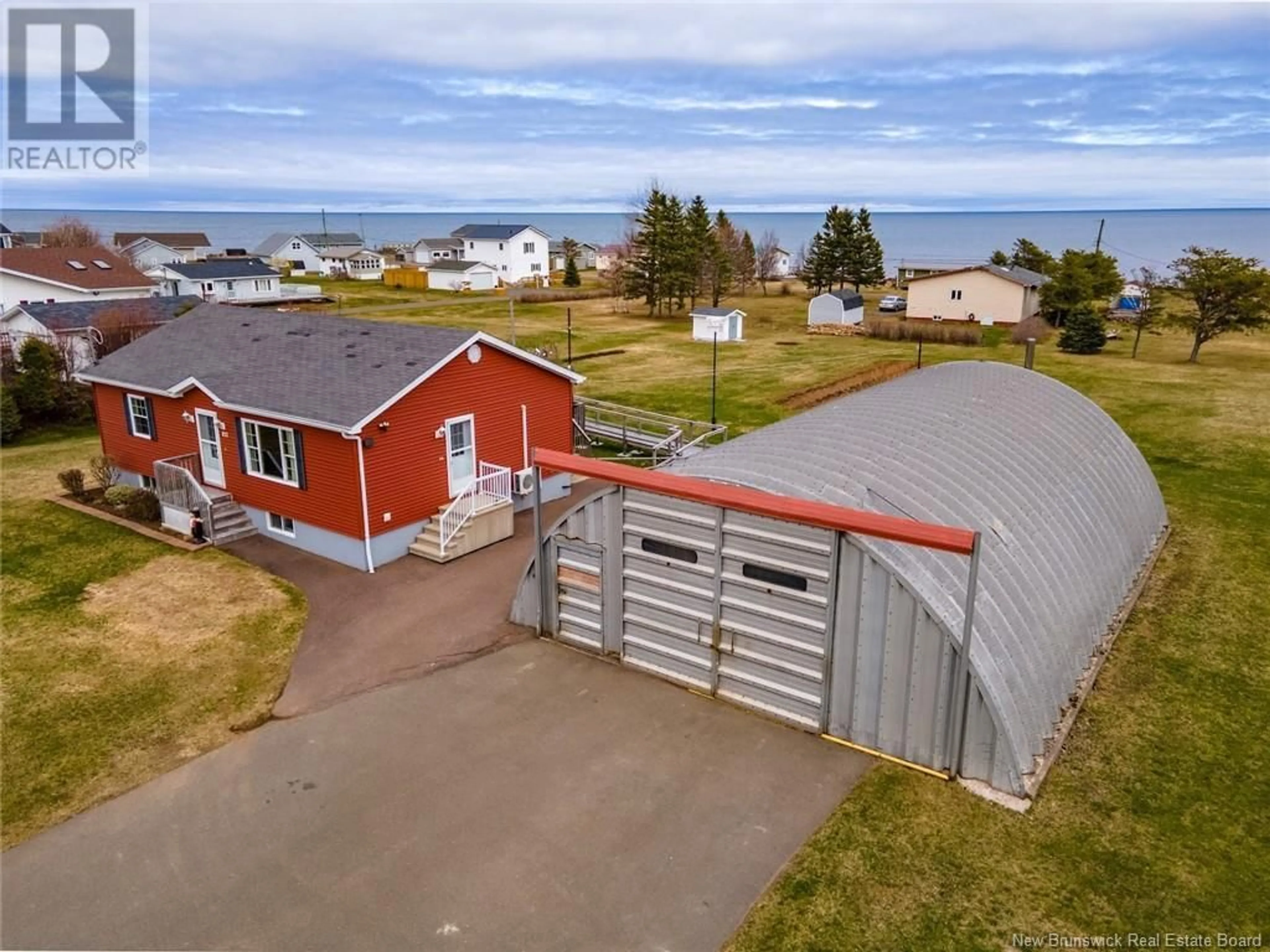 A pic from outside/outdoor area/front of a property/back of a property/a pic from drone, water/lake/river/ocean view for 112 CH DE LA COTE, Grande-Digue New Brunswick E4R4C1