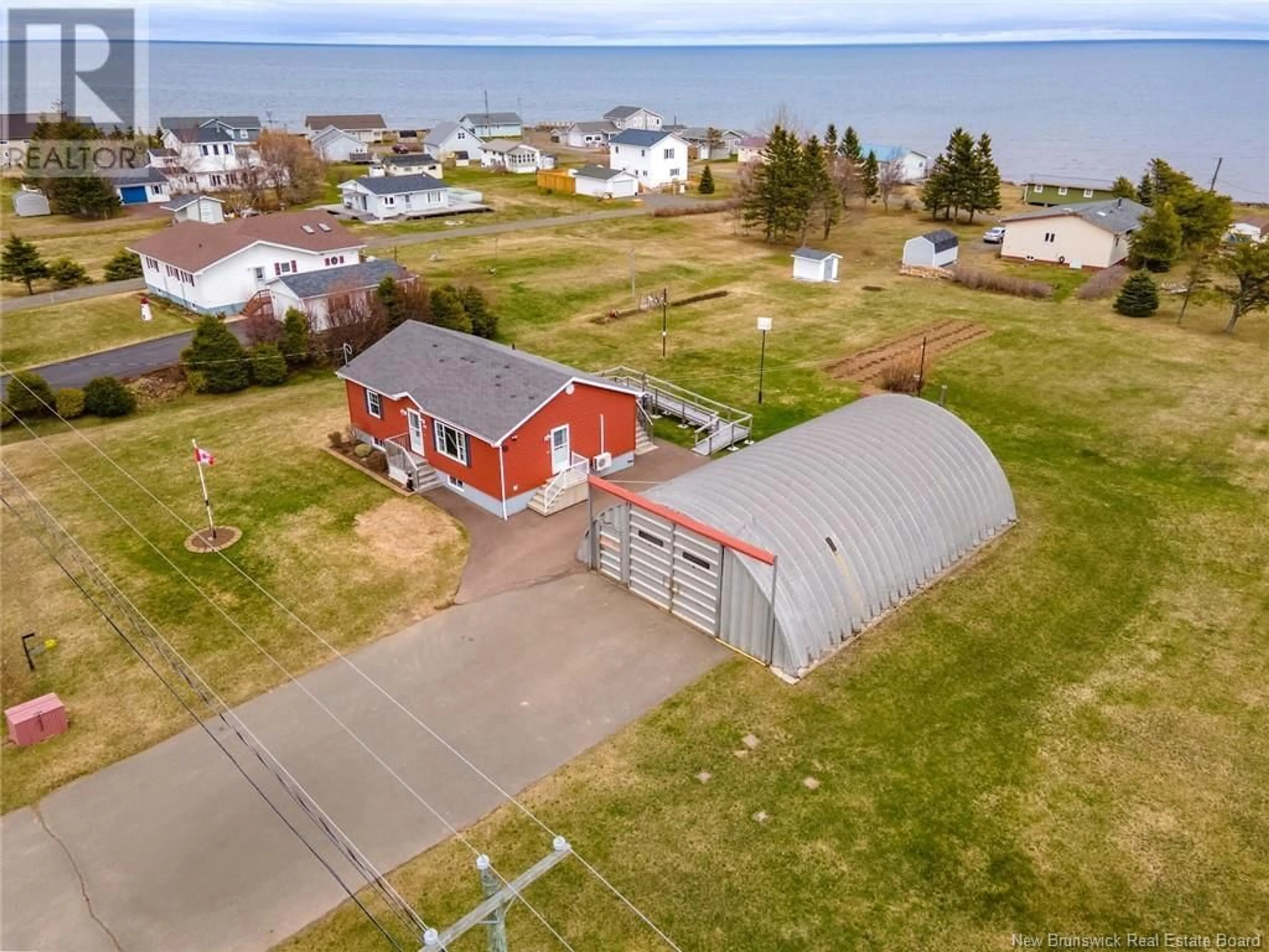 A pic from outside/outdoor area/front of a property/back of a property/a pic from drone, water/lake/river/ocean view for 112 CH DE LA COTE, Grande-Digue New Brunswick E4R4C1