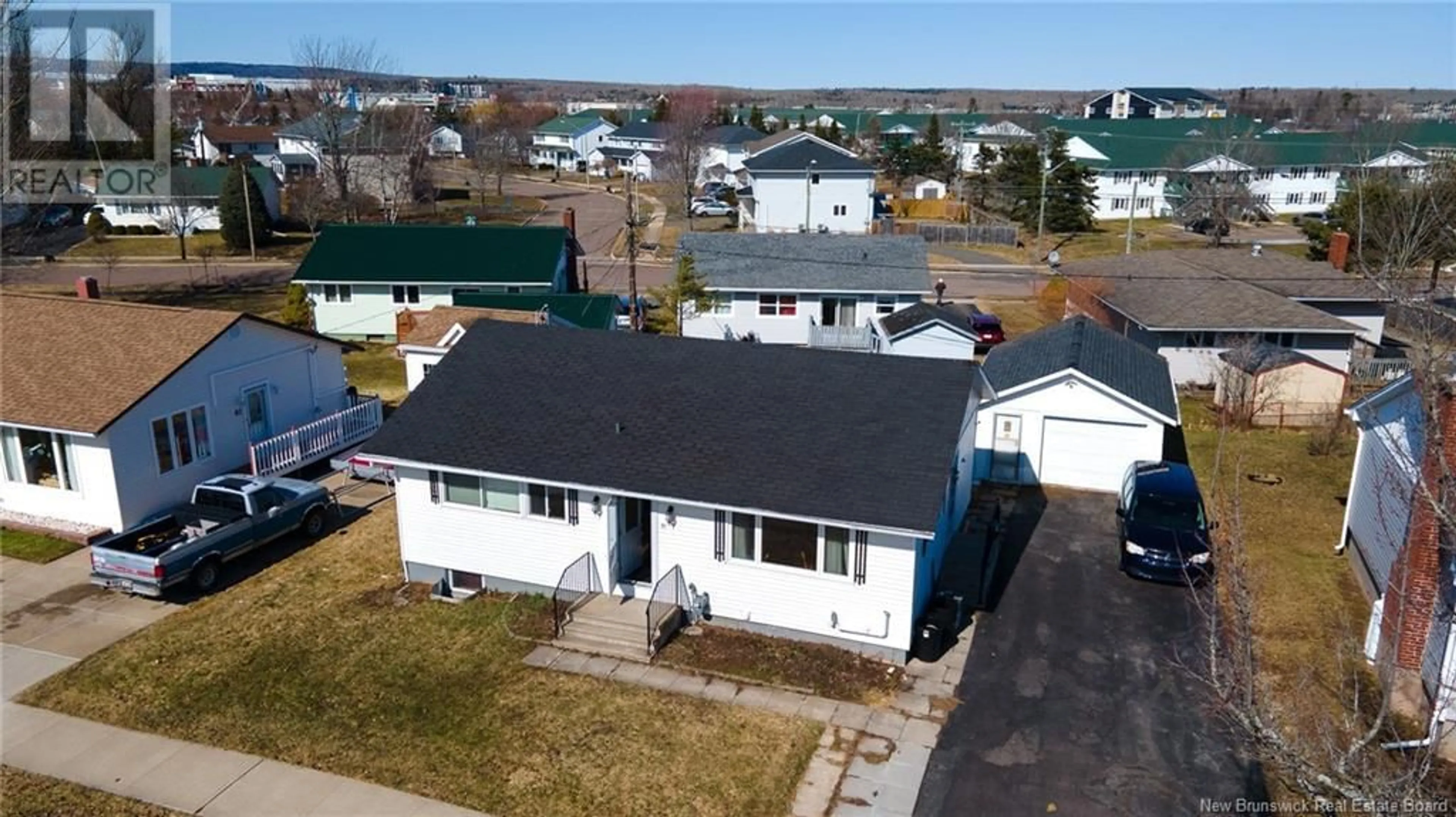 A pic from outside/outdoor area/front of a property/back of a property/a pic from drone, street for 51 WINDEMERE DRIVE, Moncton New Brunswick E1C4L2