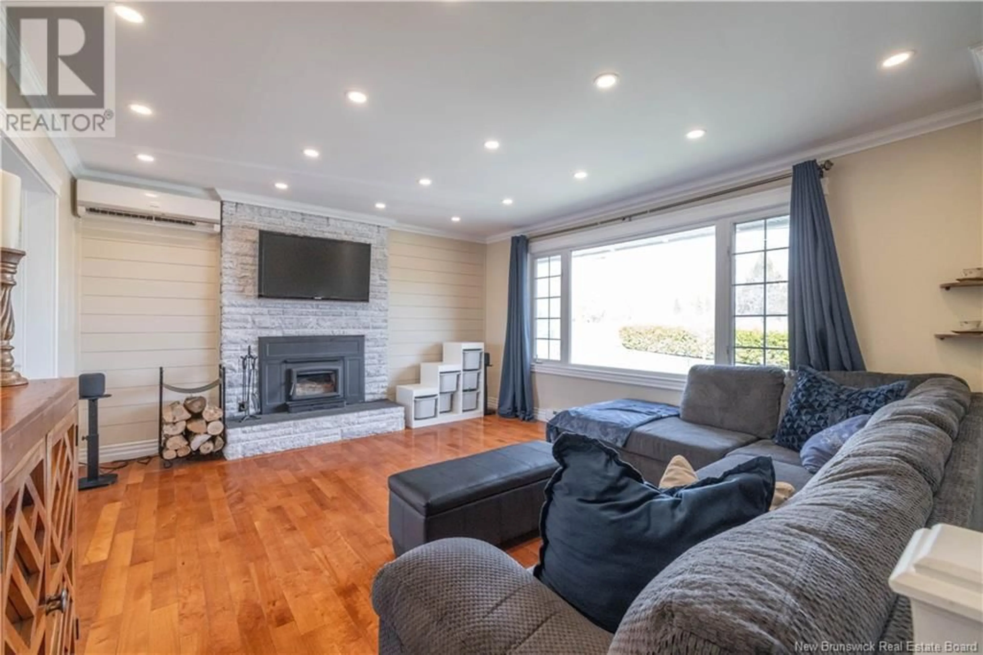Living room with furniture, wood/laminate floor for 594 HAMPTON ROAD, Quispamsis New Brunswick E2G1C8
