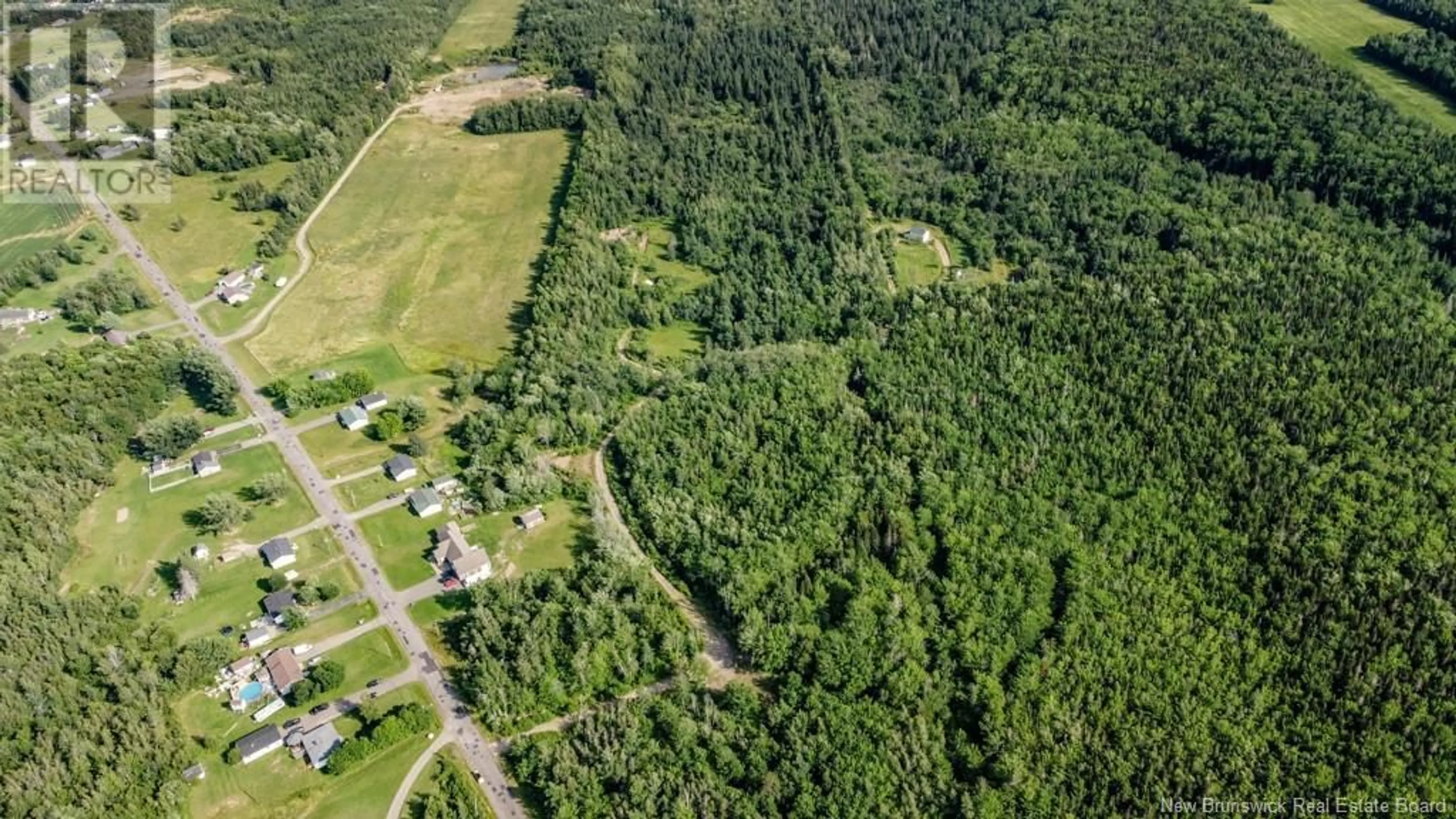 A pic from outside/outdoor area/front of a property/back of a property/a pic from drone, forest/trees view for 156 BOIS JOLI ROAD, Bouctouche New Brunswick E4S2X1