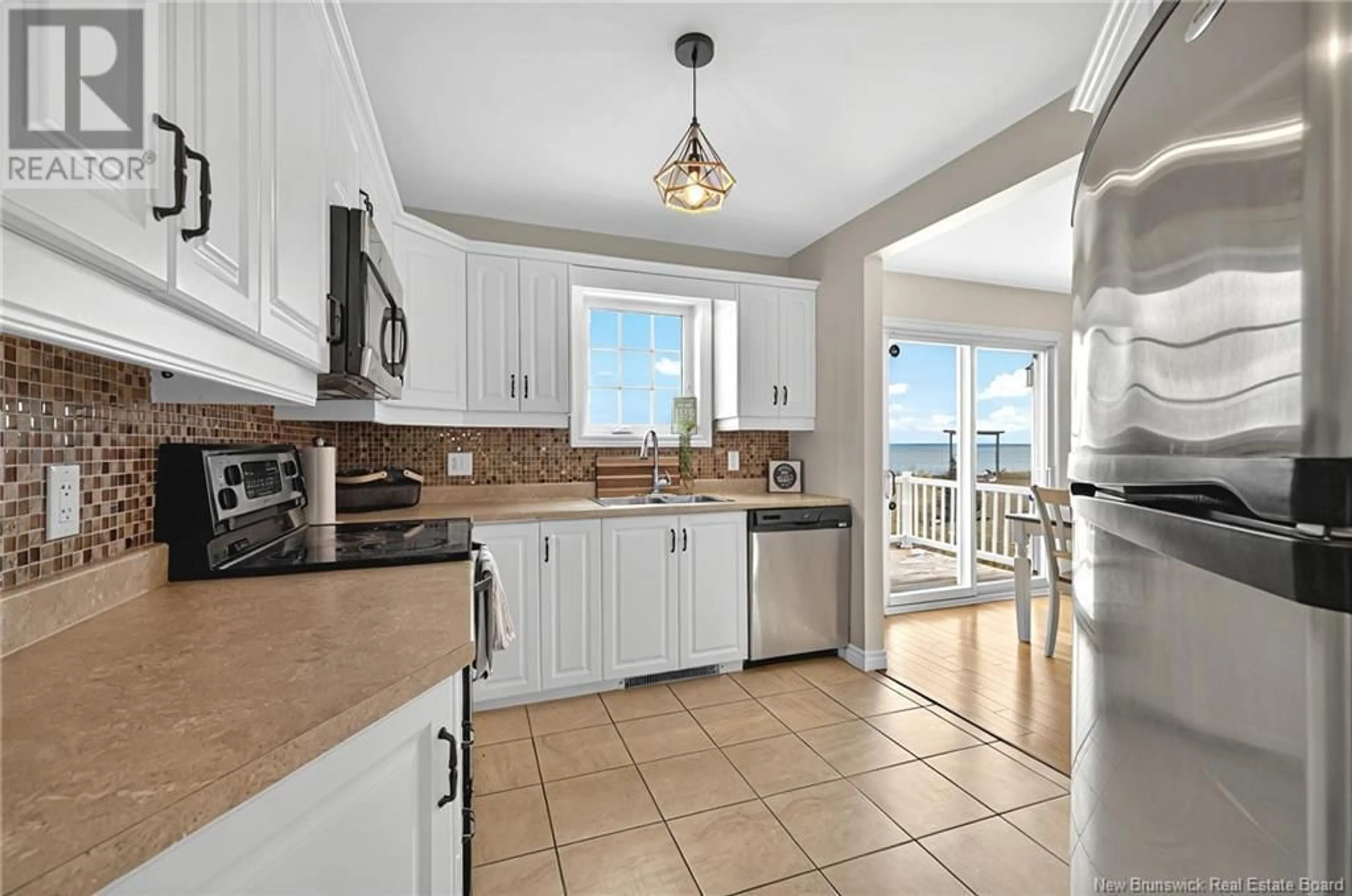 Open concept kitchen, ceramic/tile floor for 657 BAIE, Beresford New Brunswick E8K1X3