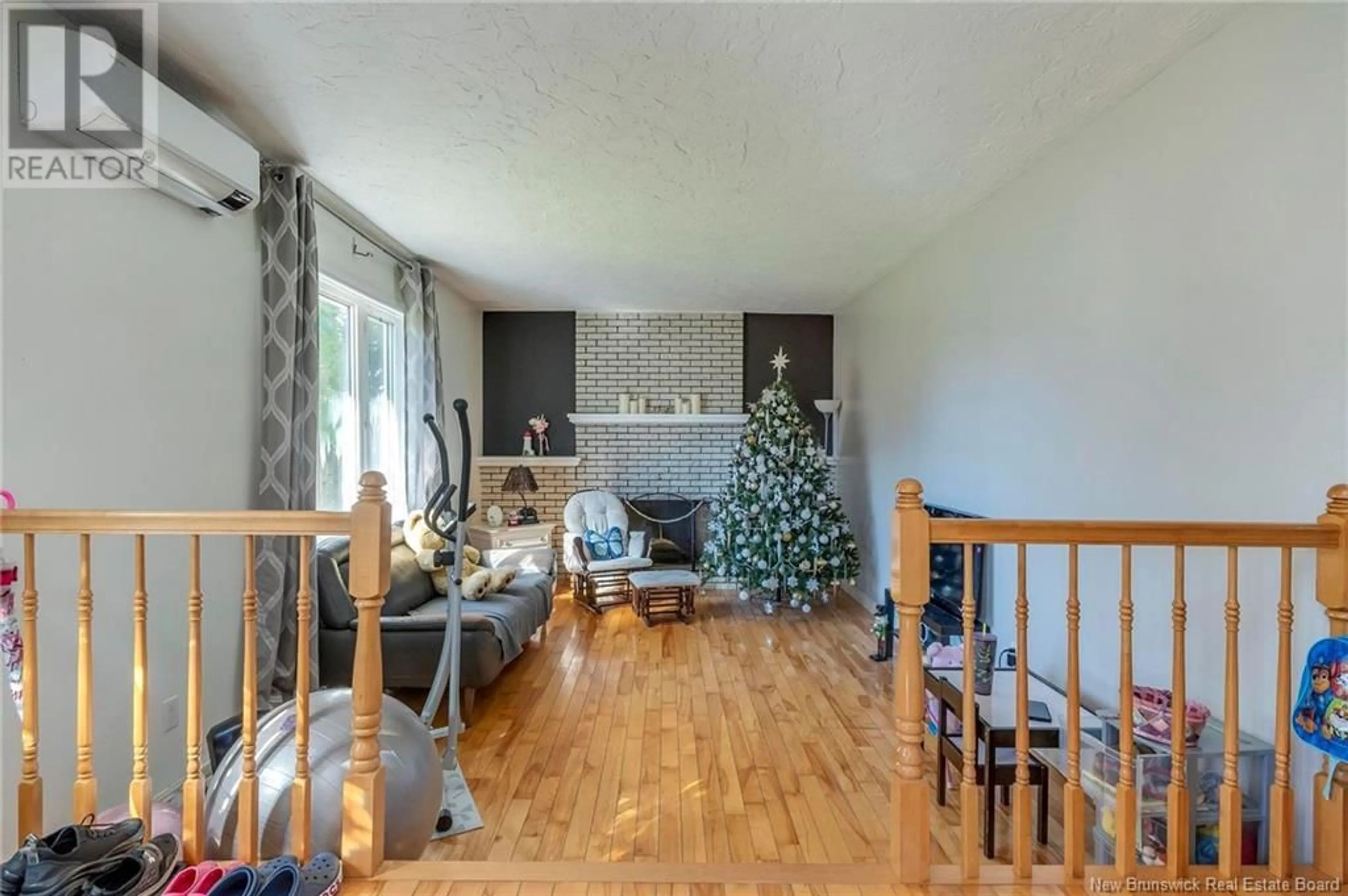 Living room with furniture, wood/laminate floor for 215 SPRUCE STREET, Moncton New Brunswick E1C7K5