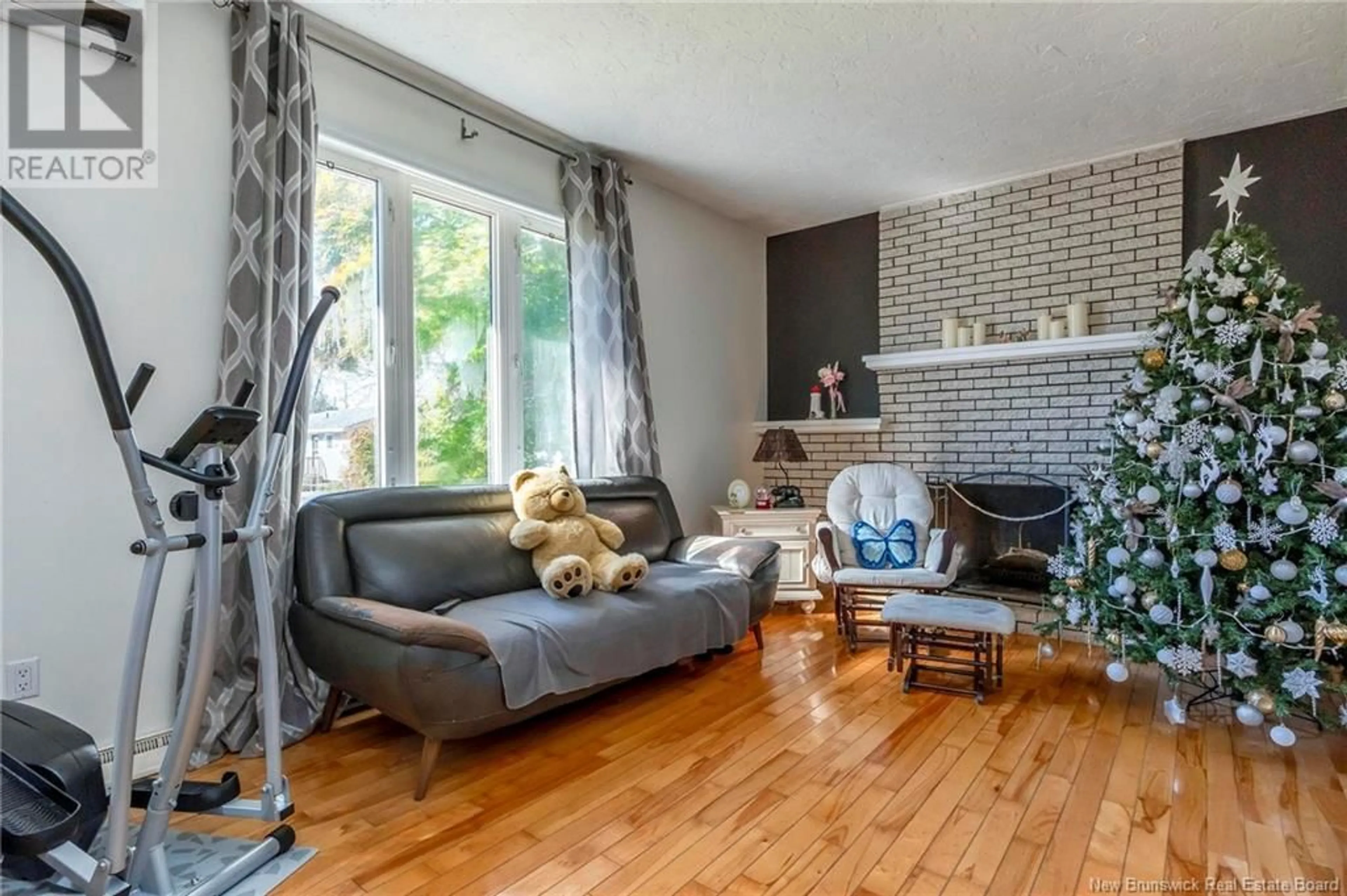 Living room with furniture, wood/laminate floor for 215 SPRUCE STREET, Moncton New Brunswick E1C7K5
