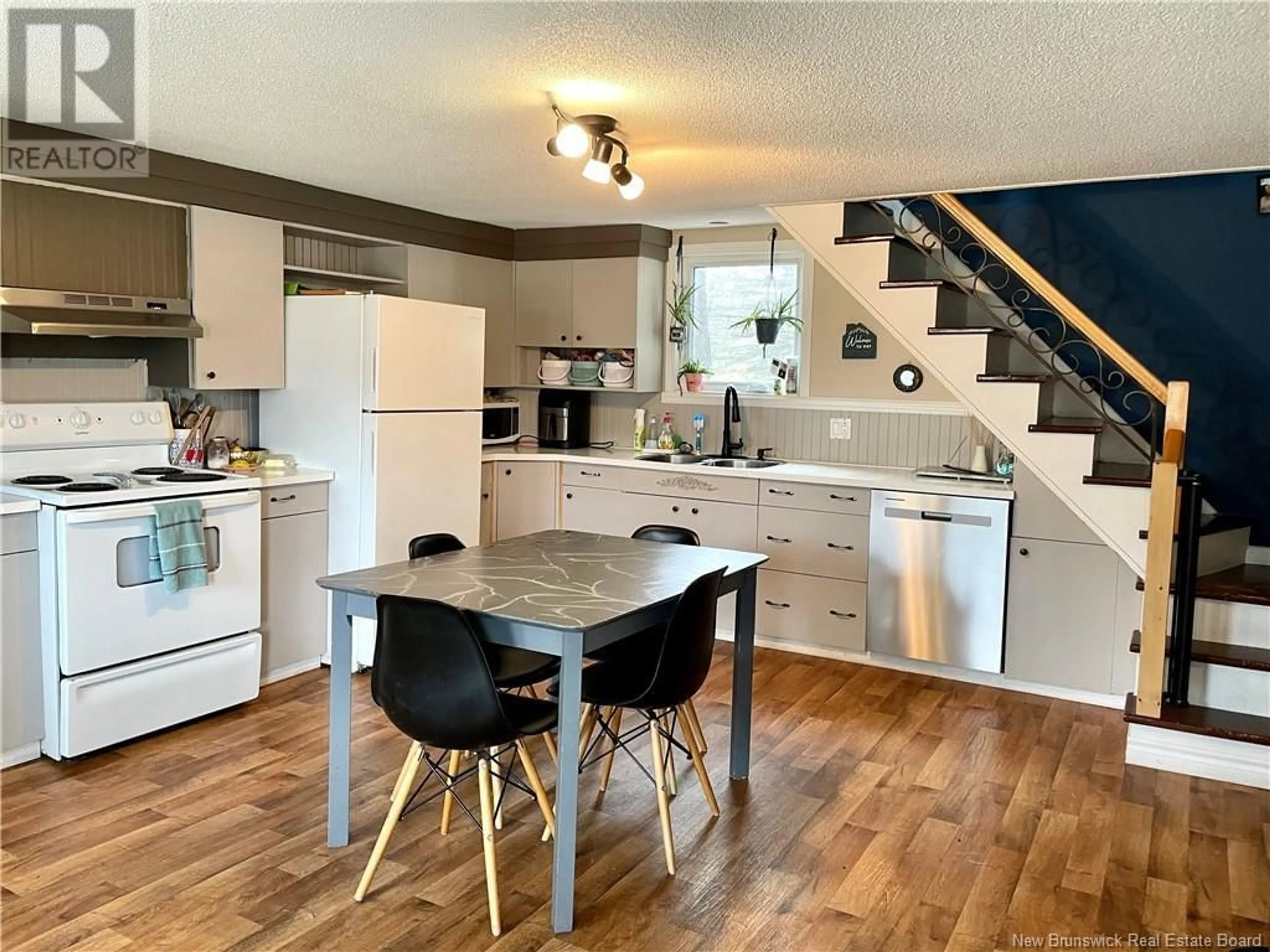 Open concept kitchen, wood/laminate floor for 54 FORT AVENUE, Edmundston New Brunswick E3V1E1