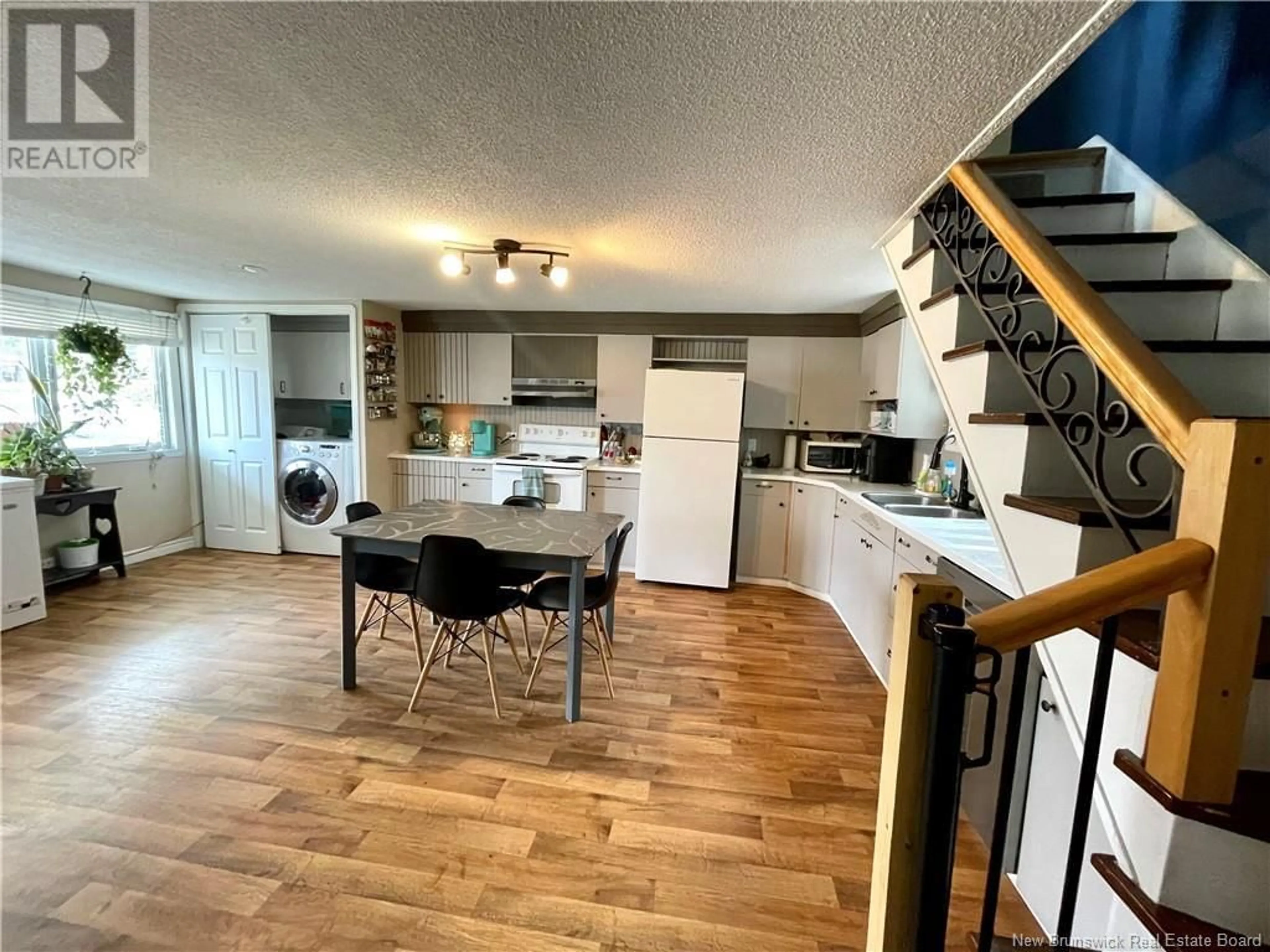 Open concept kitchen, wood/laminate floor for 54 FORT AVENUE, Edmundston New Brunswick E3V1E1