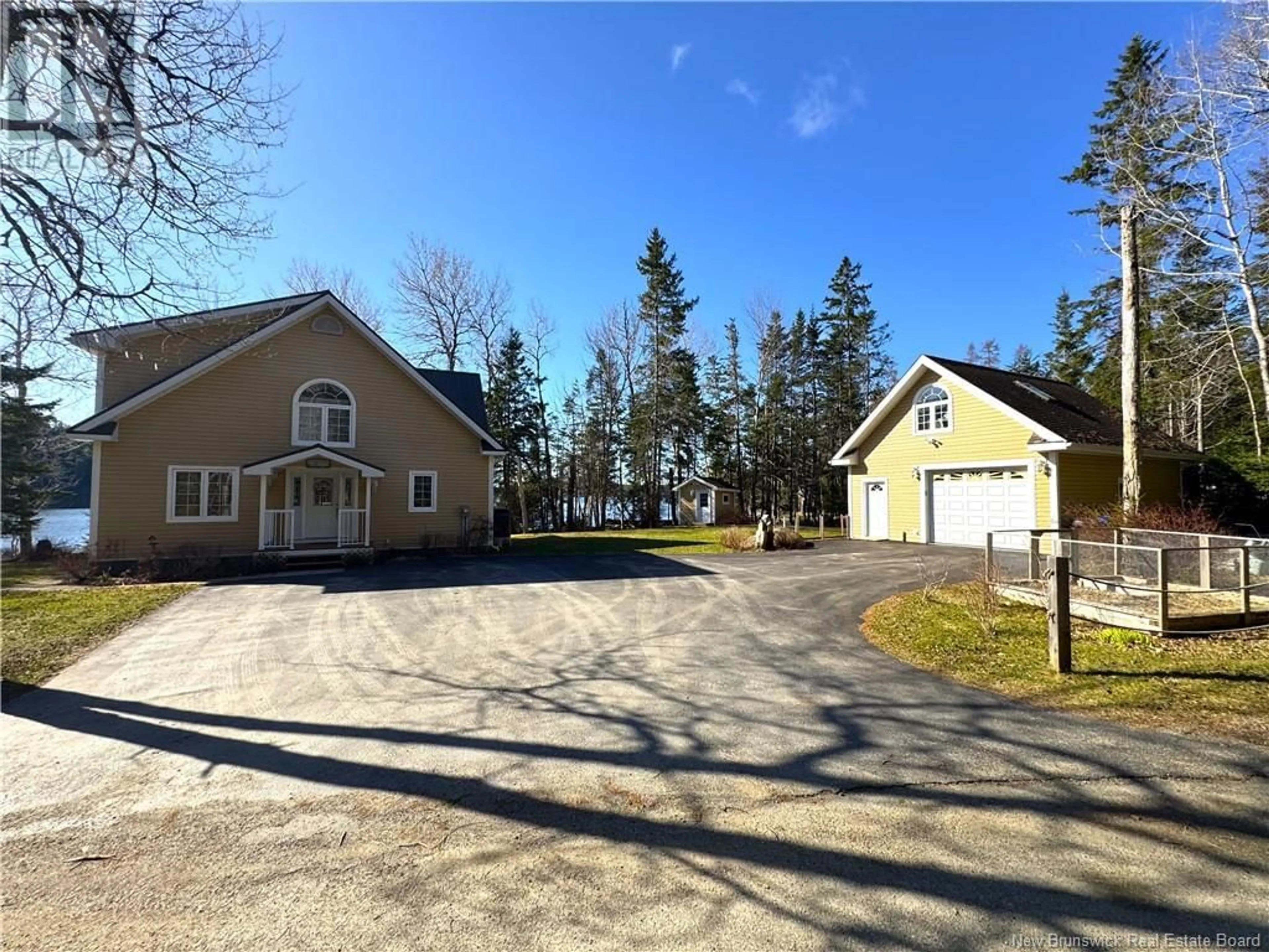 A pic from outside/outdoor area/front of a property/back of a property/a pic from drone, street for 38 SHORE ROAD, Oak Bay New Brunswick E3L4C6