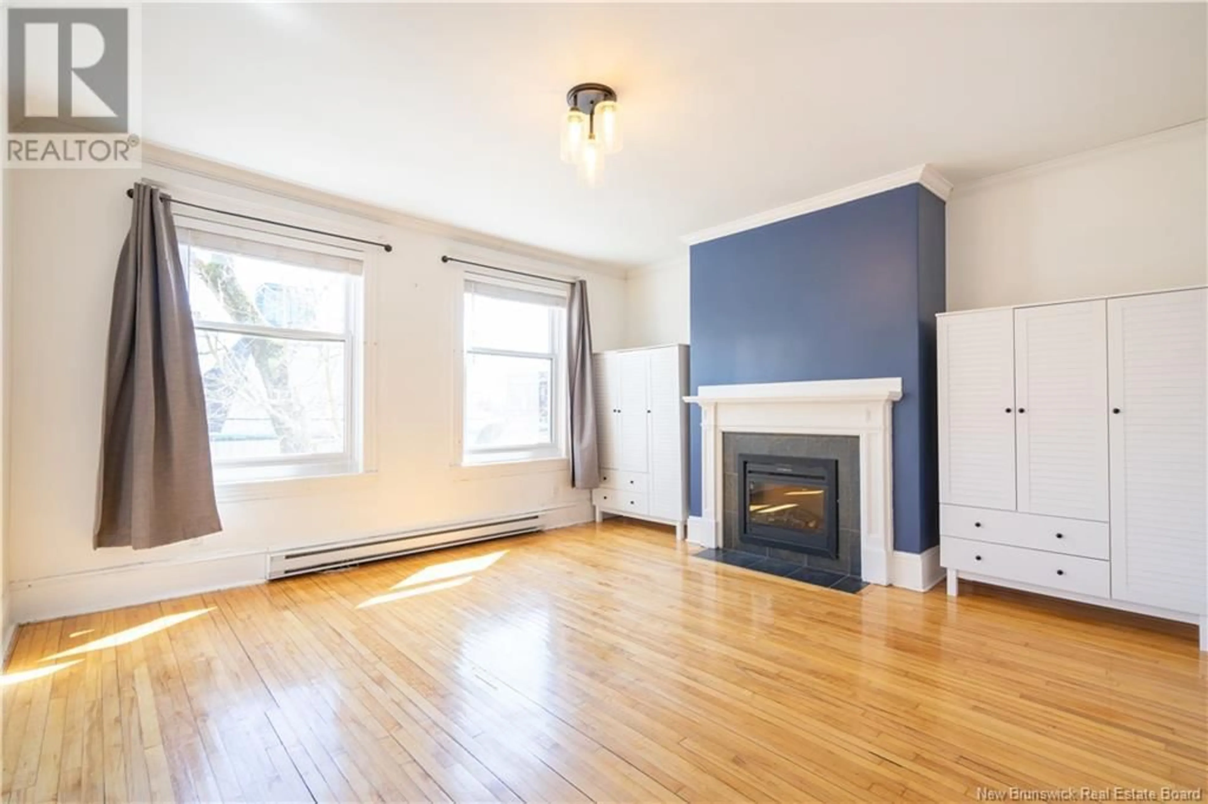 Living room with furniture, wood/laminate floor for 4 - 247 GERMAIN STREET, Saint John New Brunswick E2L2G5