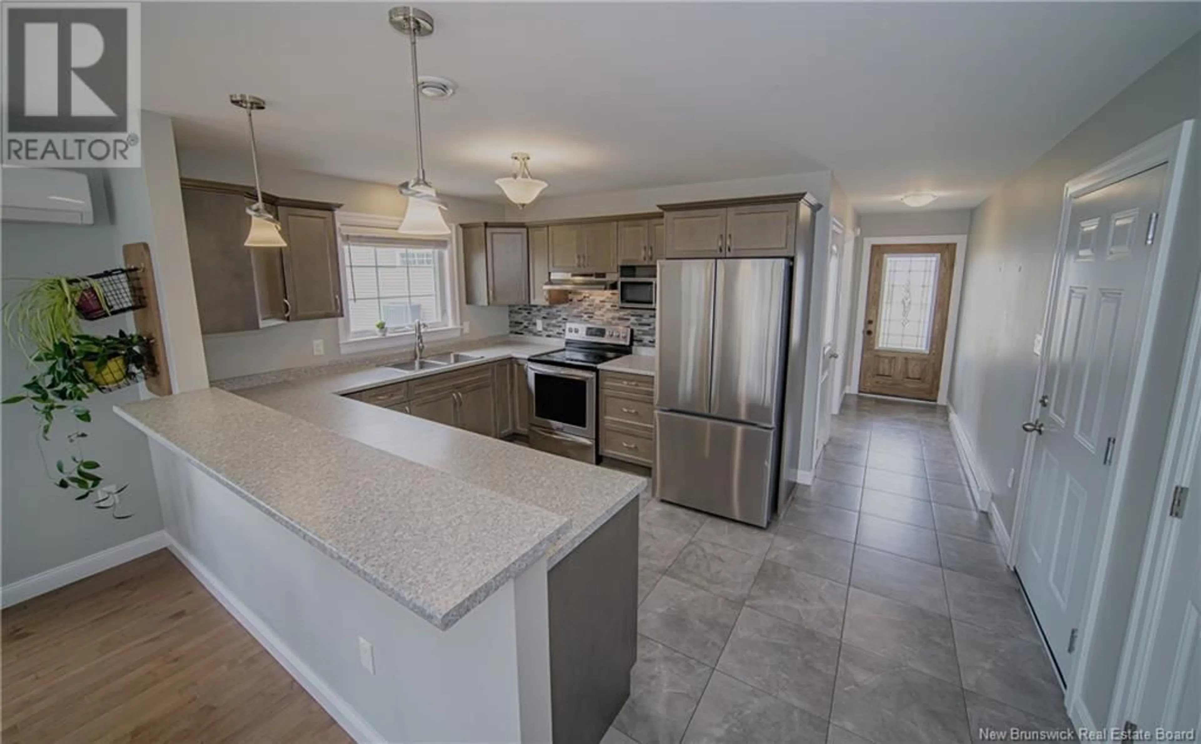 Open concept kitchen, ceramic/tile floor for 27 AUGUSTA CLOSE, Fredericton New Brunswick E3B0M7