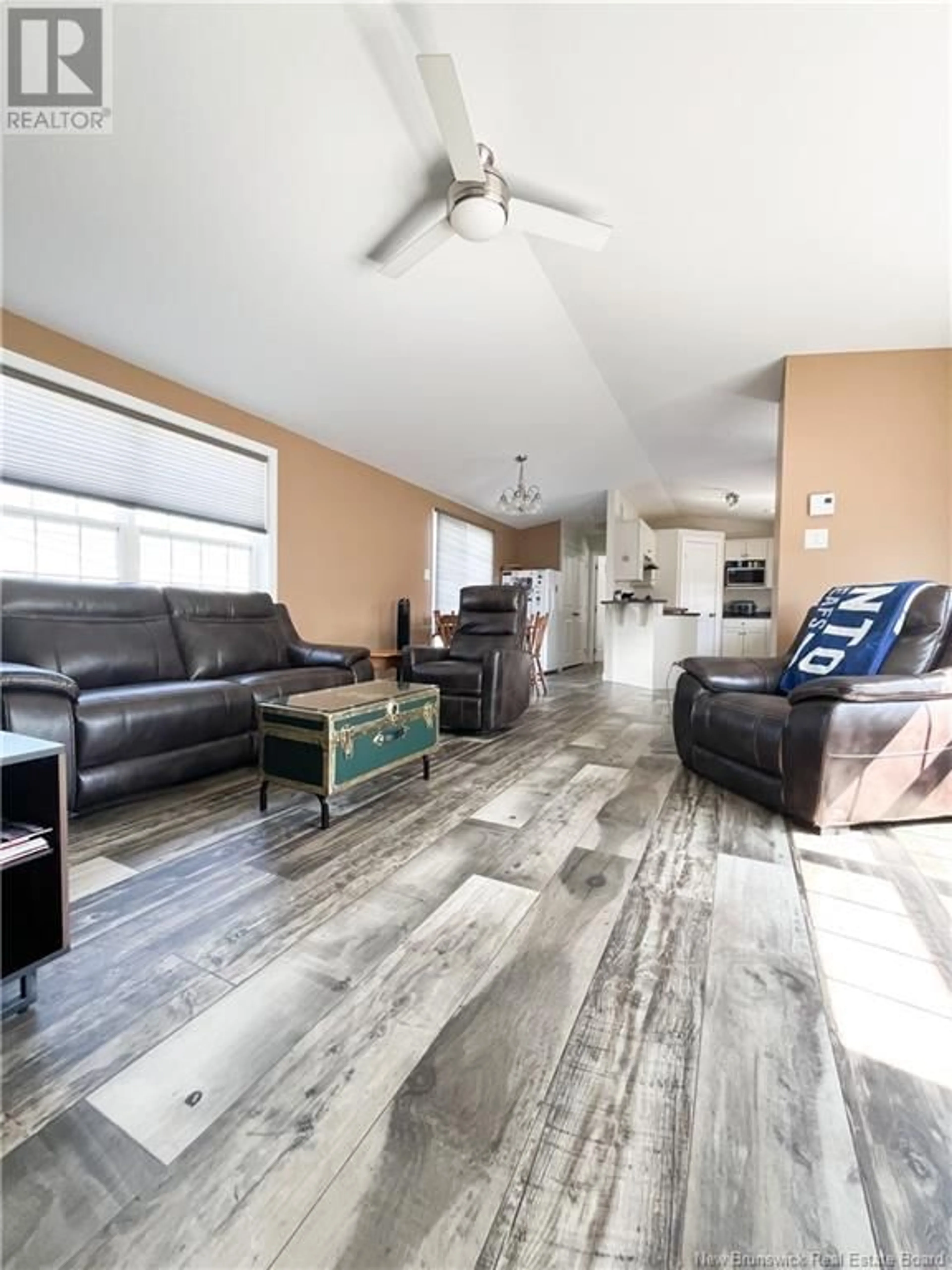 Living room with furniture, wood/laminate floor for 11 RAMSAY STREET, Lincoln New Brunswick E3B6X1