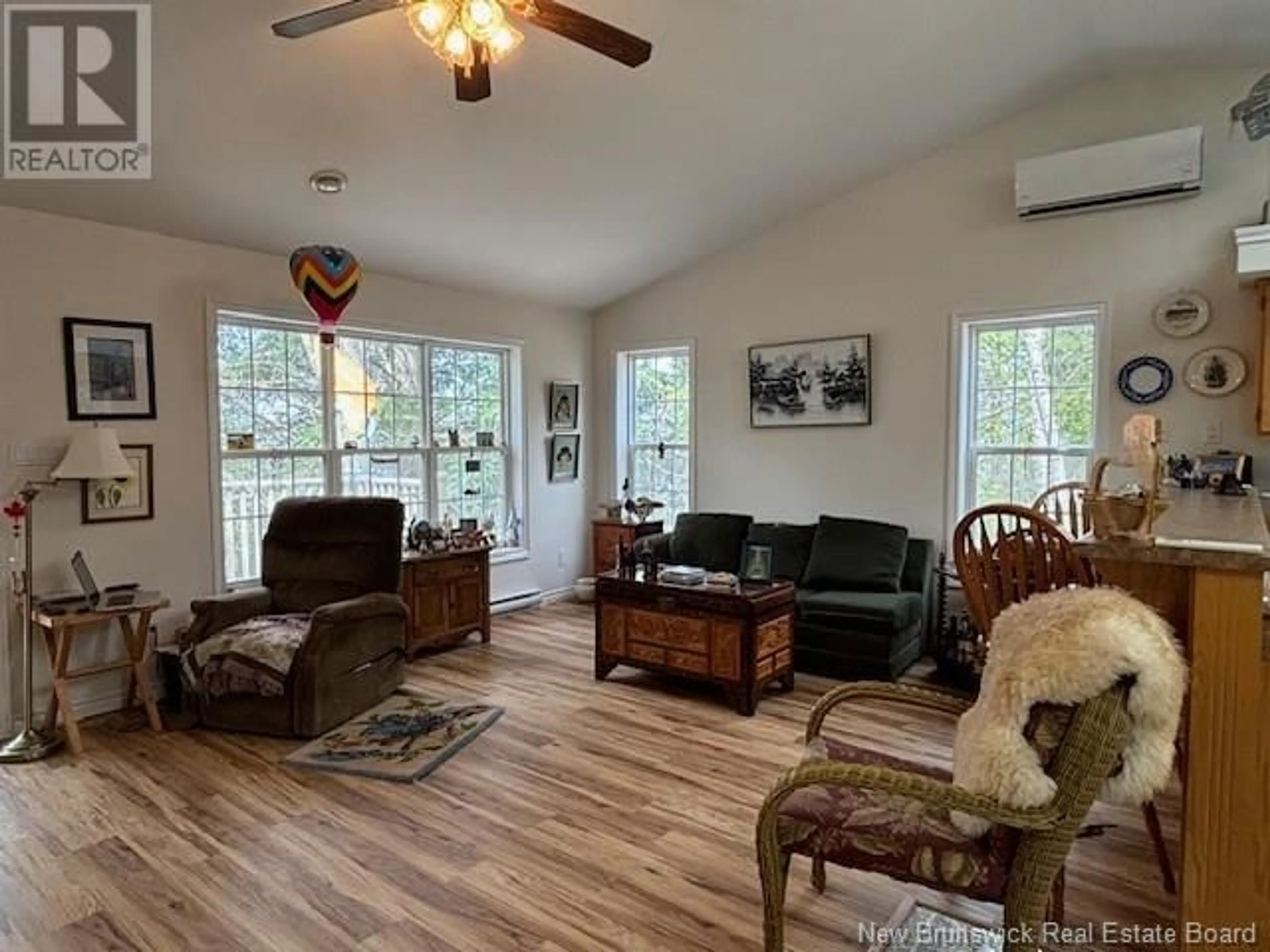 Living room with furniture, wood/laminate floor for 16 PHYLLIS LANE, Wickham New Brunswick E5T1L3