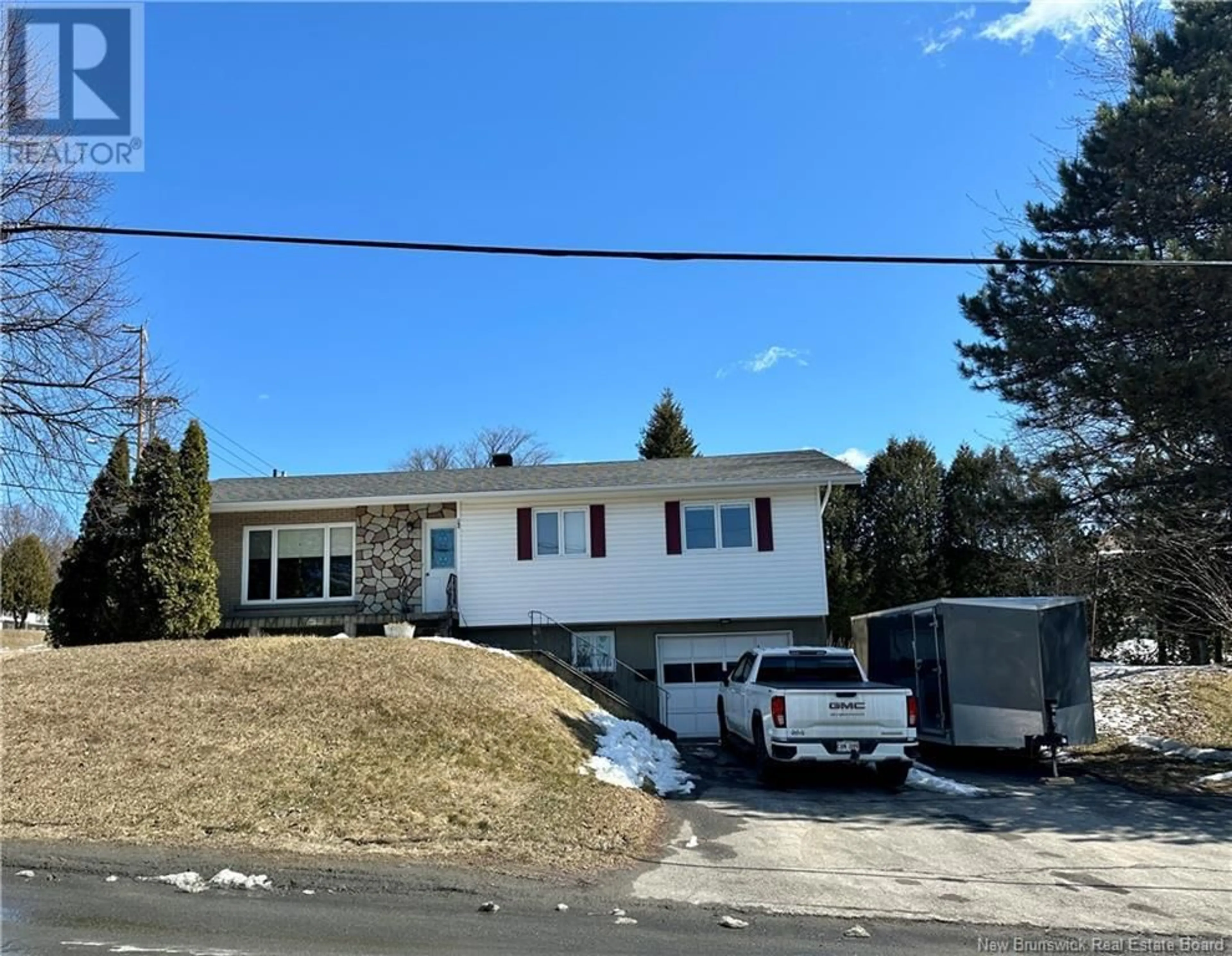 Home with vinyl exterior material, street for 65 32E AVENUE, Edmundston New Brunswick E3V2S1