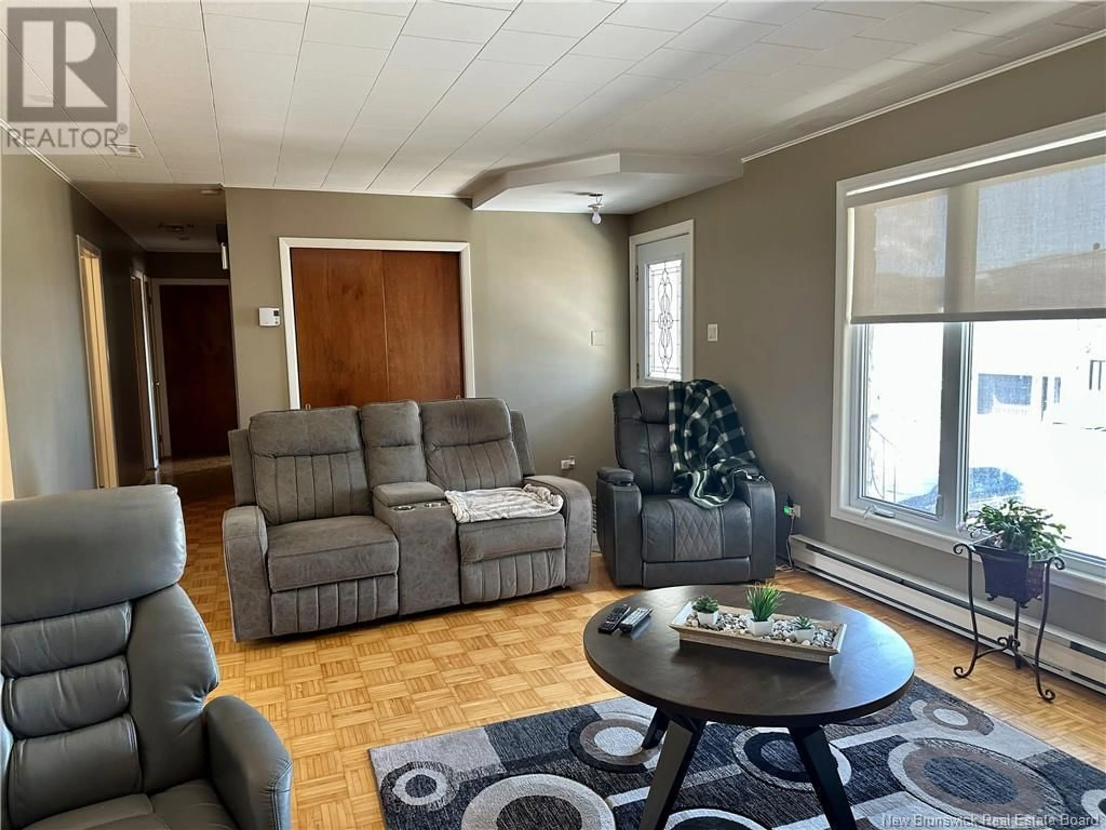 Living room with furniture, unknown for 65 32E AVENUE, Edmundston New Brunswick E3V2S1