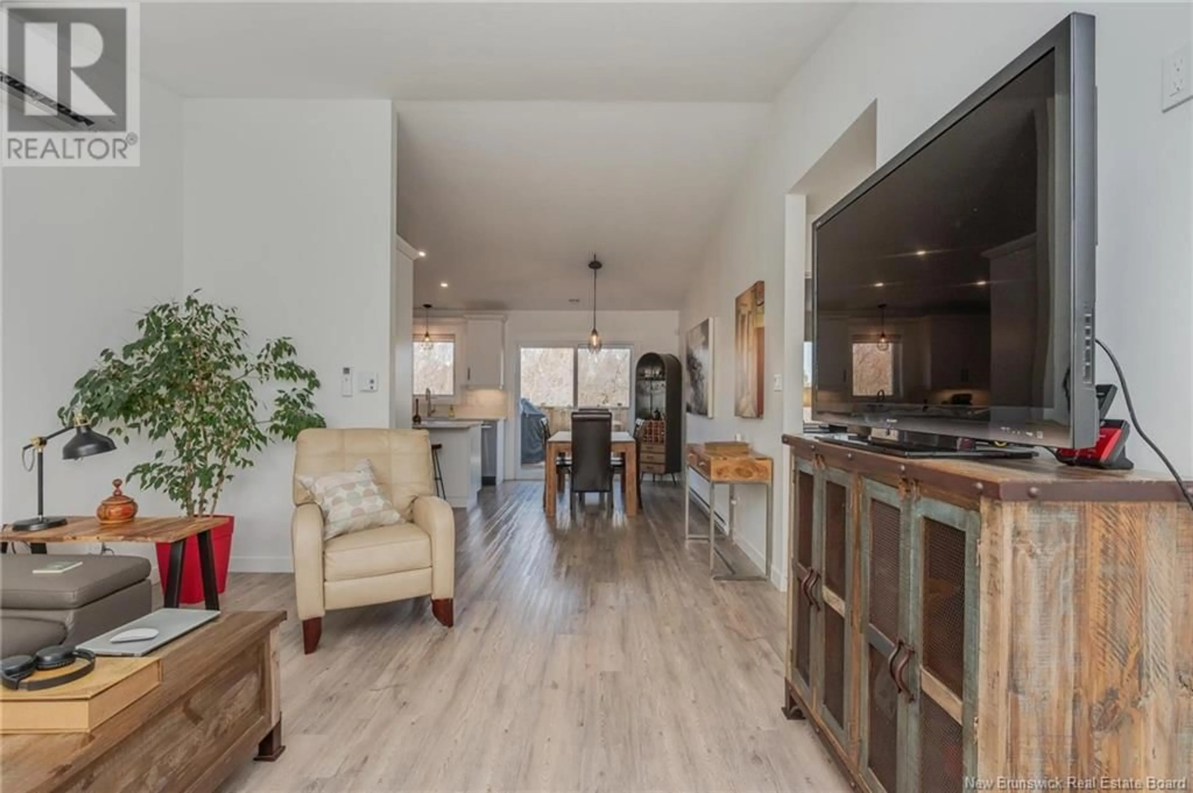 Open concept kitchen, wood/laminate floor for 14 ORIN DRIVE, Riverview New Brunswick E1B3X5
