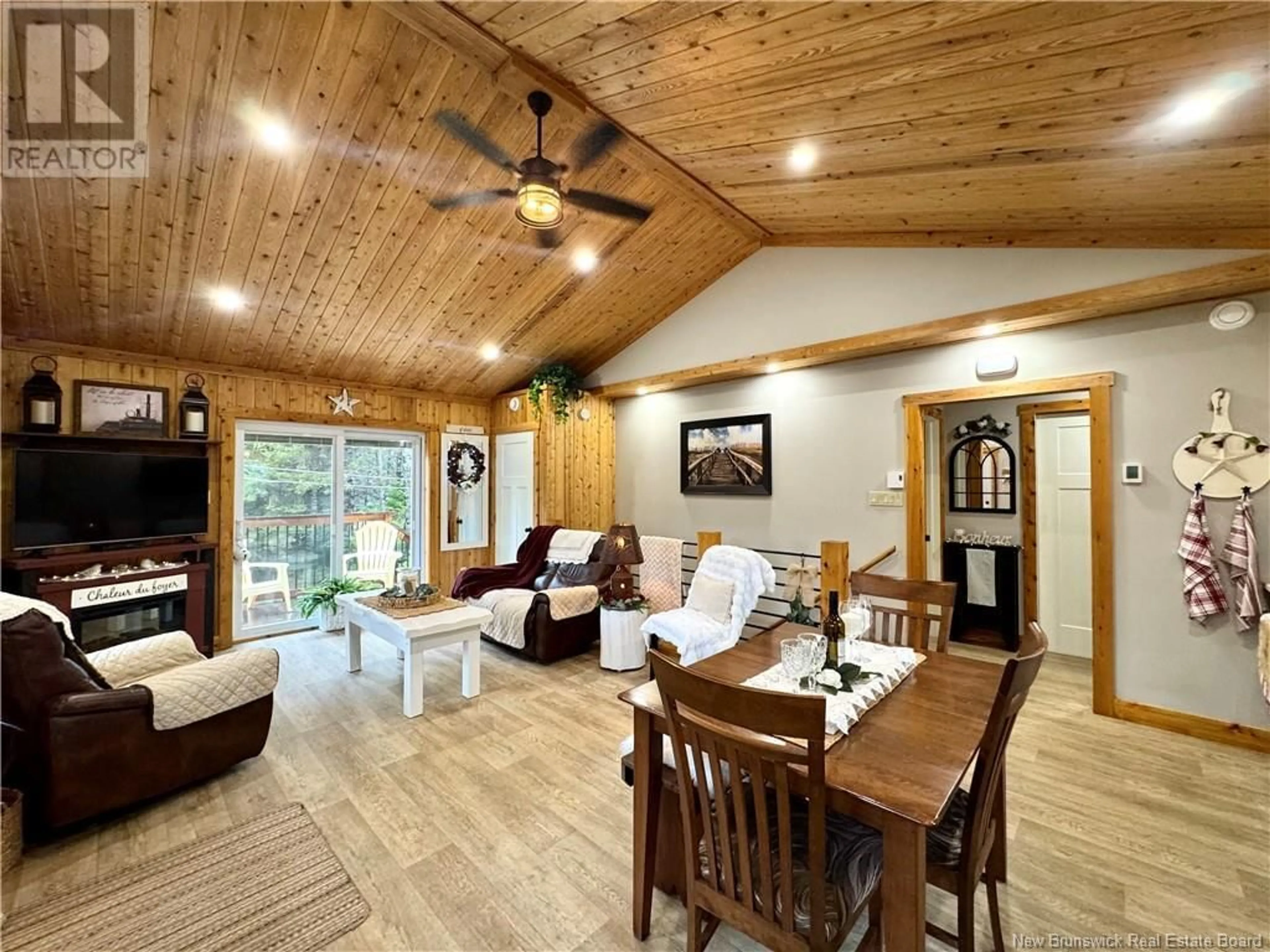 Living room with furniture, wood/laminate floor for 101 COOMBES ROAD, Saint-Léonard-Parent New Brunswick E7E2P8