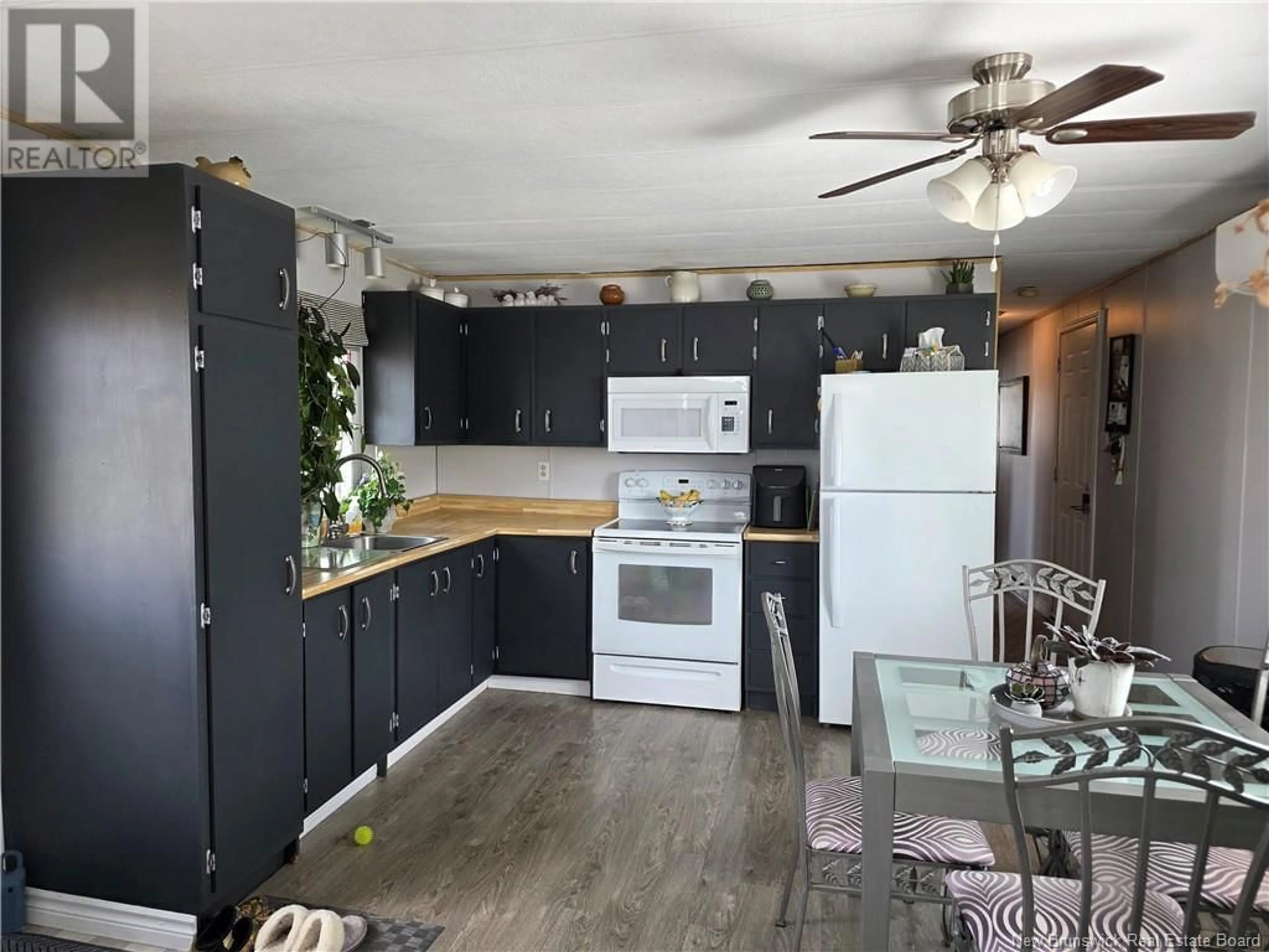 Open concept kitchen, wood/laminate floor for 2 MACINTOSH STREET, Fredericton New Brunswick E3C1L8