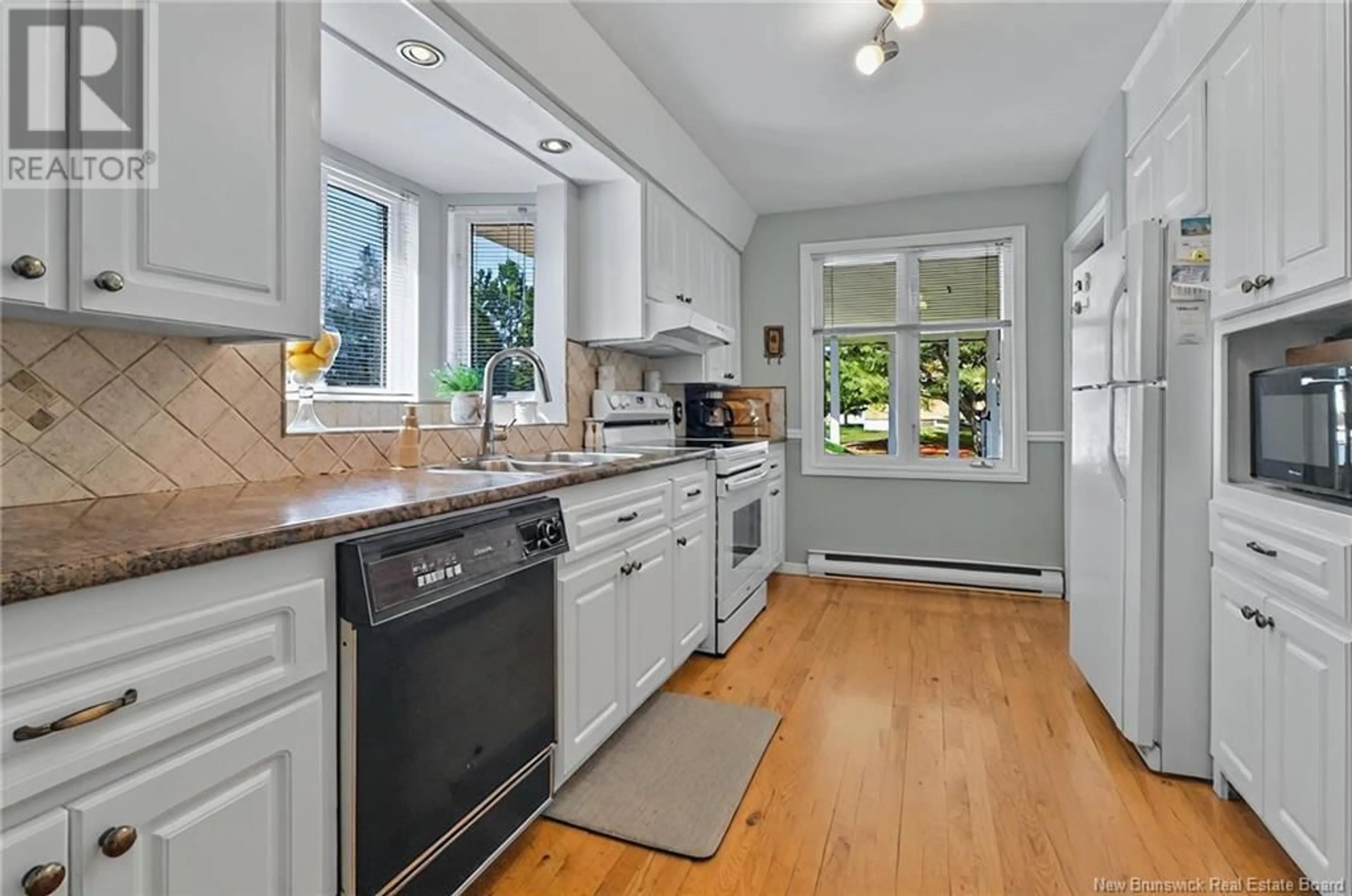 Open concept kitchen, ceramic/tile floor for 39 RENAUD ROAD, Saint-Antoine New Brunswick E4V1M9