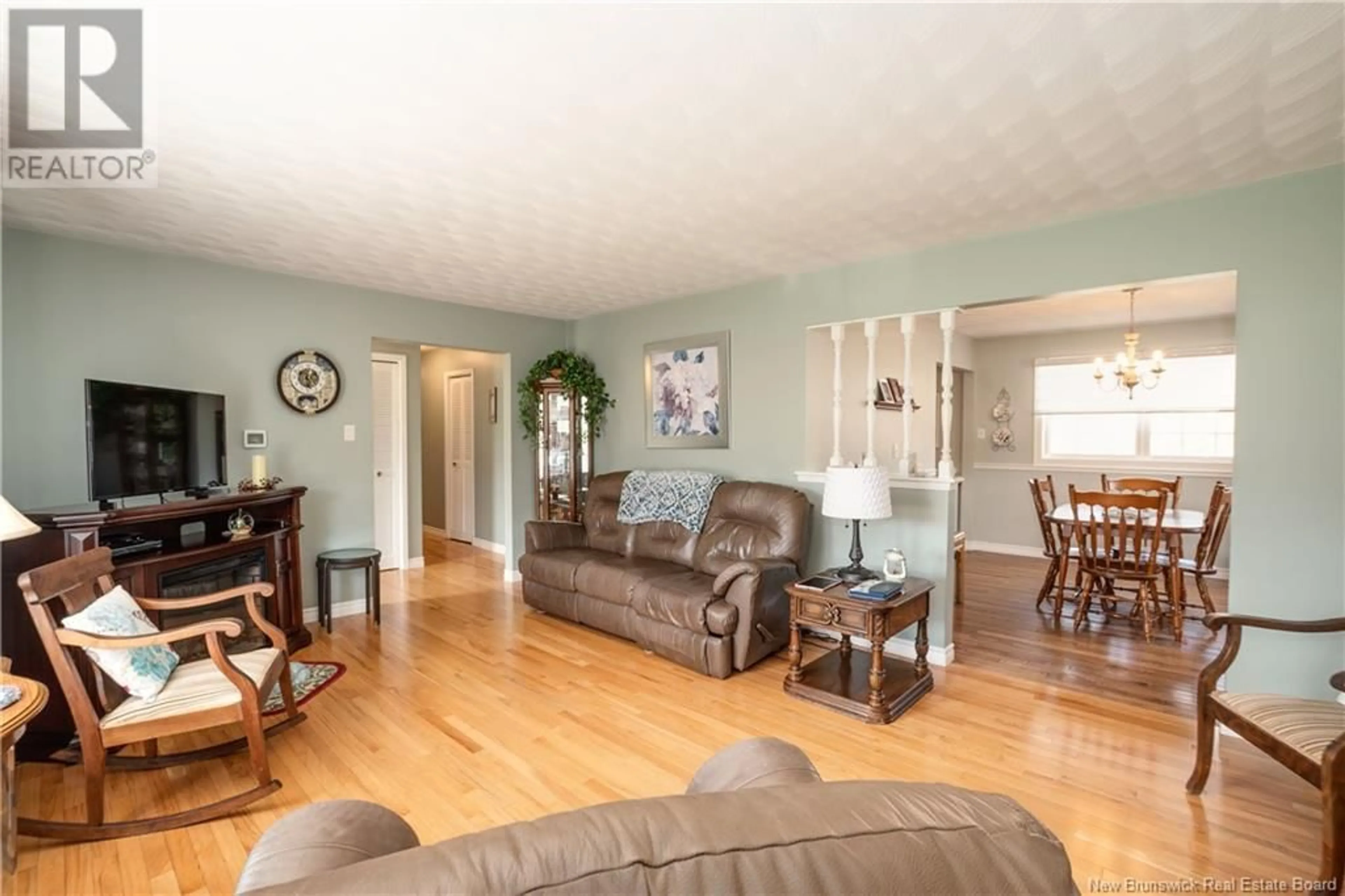 Living room with furniture, wood/laminate floor for 895 ROUTE 910, Turtle Creek New Brunswick E1J2C4